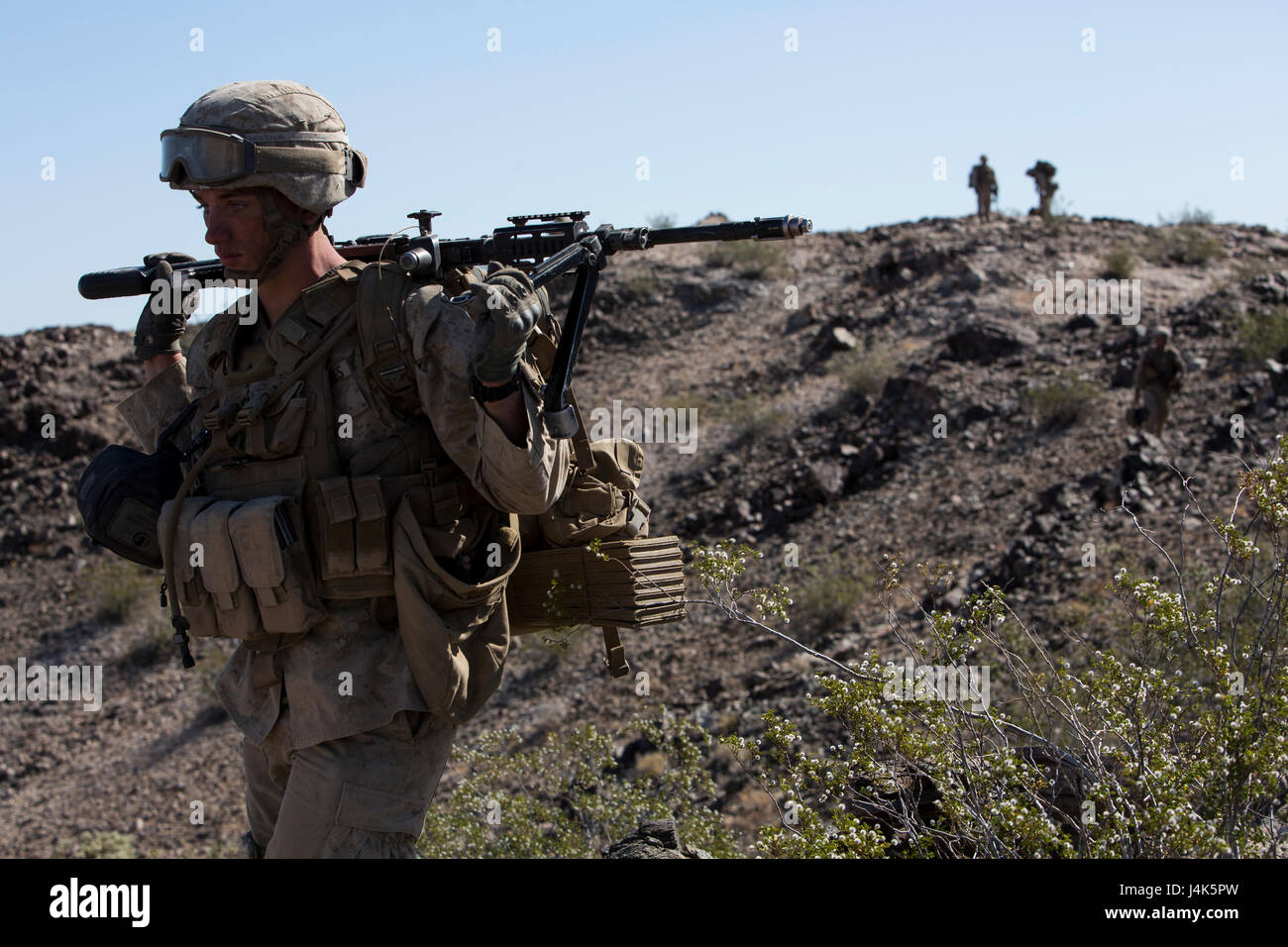 A U.S. Marine with 2nd Battalion, 6th Marine Regiment, 2nd Marine Division (2d MARDIV), hikes down a hill for a battalion-level defensive position for Talon Exercise (TalonEx) 2-17, Yuma, A.Z., April 19, 2017. The purpose of TalonEx was for ground combat units to conduct integrated training in support of the Weapons and Tactics Instructor Course (WTI) 2-17 hosted by Marine Aviation Weapons and Tactics Squadron One (MAWTS-1). Stock Photo