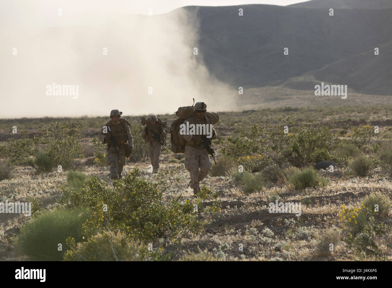 U.S. Marines with 2nd Battalion, 6th Marine Regiment, 2nd Marine Division (2d MARDIV), advance toward their objective following an insert from CH-53E Super Stallions during Talon Exercise (TalonEx) 2-17, Yuma, A.Z., April 25, 2017. The purpose of TalonEx was for ground combat units to conduct integrated training in support of the Weapons and Tactics Instructor Course (WTI) 2-17 hosted by Marine Aviation Weapons and Tactics Squadron One (MAWTS-1). Stock Photo