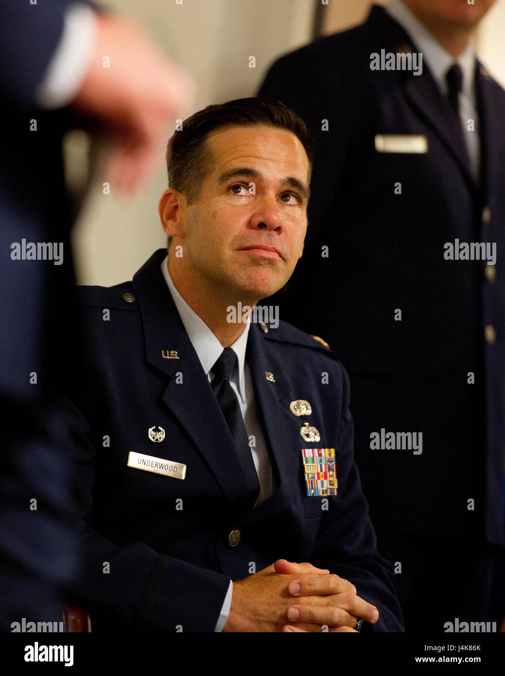 U.S. Air Force Maj. Hamilton Underwood listens to opening remarks given by U.S. Air Force Lt. Col. John Robinson, commander of the 315th Operations Group, before he assumes command of the newly activated 4th Combat Camera Squadron at Joint Base Charleston, South Carolina, May 5, 2017. The 4th CTCS was reactivated in South Carolina after being deactivated August 2015 in California. (U.S. Air Force photo by Tech. Sgt. Stephen D. Schester) Stock Photo
