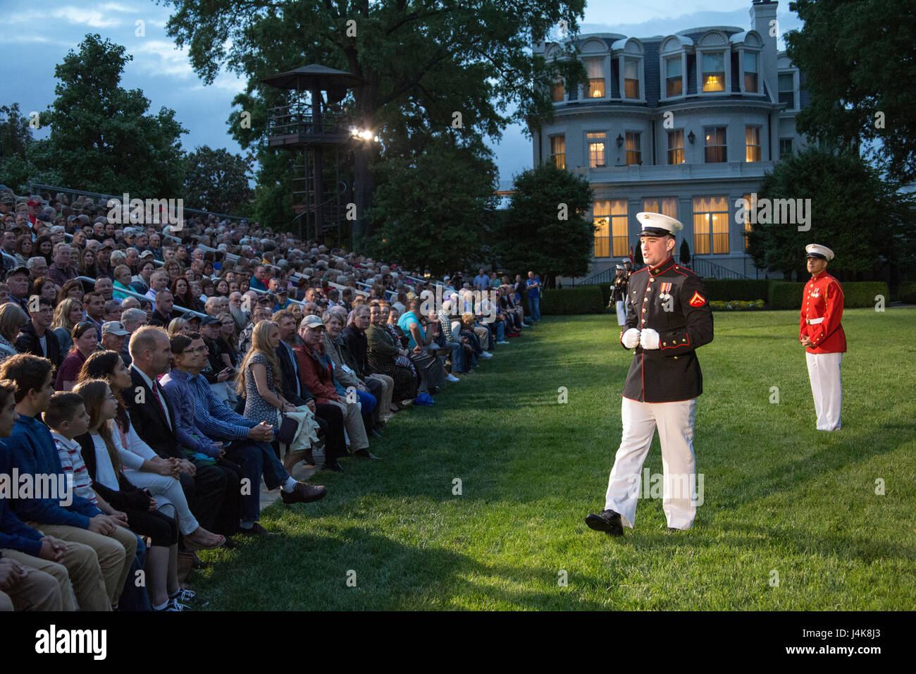 Crowd educators with Marine Barracks Washington D.C. give guests a brief history of the Barracks during a Friday Evening Parade at Marine Barracks Washington D.C., May 5, 2017. The guests of honor for the parade were the Honorable Paul Cook, California’s 8th Congressional District Congressman, the Honorable Jack Bergman, Michigan’s 1st Congressional District Congressman, and the Honorable Salud Carbajal, California’s 24th Congressional District Congressman. The hosting official was Gen. Glenn Walters, assistant commandant of the Marine Corps. (Official Marine Corps photo by Cpl. Robert Knapp/R Stock Photo
