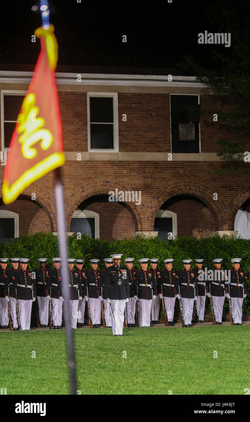 Marines with Bravo Company, Marine Barracks Washington D.C., assume the position of attention during a Friday Evening Parade at Marine Barracks Washington D.C., May 5, 2017. The guests of honor for the parade were the Honorable Paul Cook, California’s 8th Congressional District Congressman, the Honorable Jack Bergman, Michigan’s 1st Congressional District Congressman, and the Honorable Salud Carbajal, California’s 24th Congressional District Congressman. The hosting official was Gen. Glenn Walters, assistant commandant of the Marine Corps.(Official Marine Corps photo by Lance Cpl. Damon Mclean Stock Photo