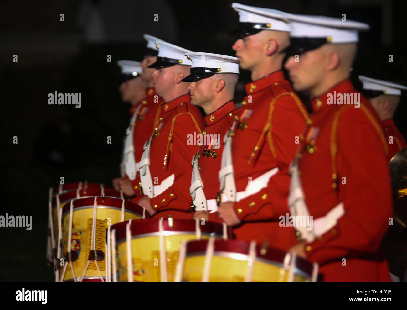 Marines with “The Commandant’s Own” the U.S. Marine Drum and Bugle Corps, perform “music in motion” during a Friday Evening Parade at Marine Barracks Washington D.C., May 5, 2017. The guests of honor for the parade were the Honorable Paul Cook, California’s 8th Congressional District Congressman, the Honorable Jack Bergman, Michigan’s 1st Congressional District Congressman, and the Honorable Salud Carbajal, California’s 24th Congressional District Congressman. The hosting official was Gen. Glenn Walters, assistant commandant of the Marine Corps.(Official Marine Corps photo by Lance Cpl. Damon  Stock Photo