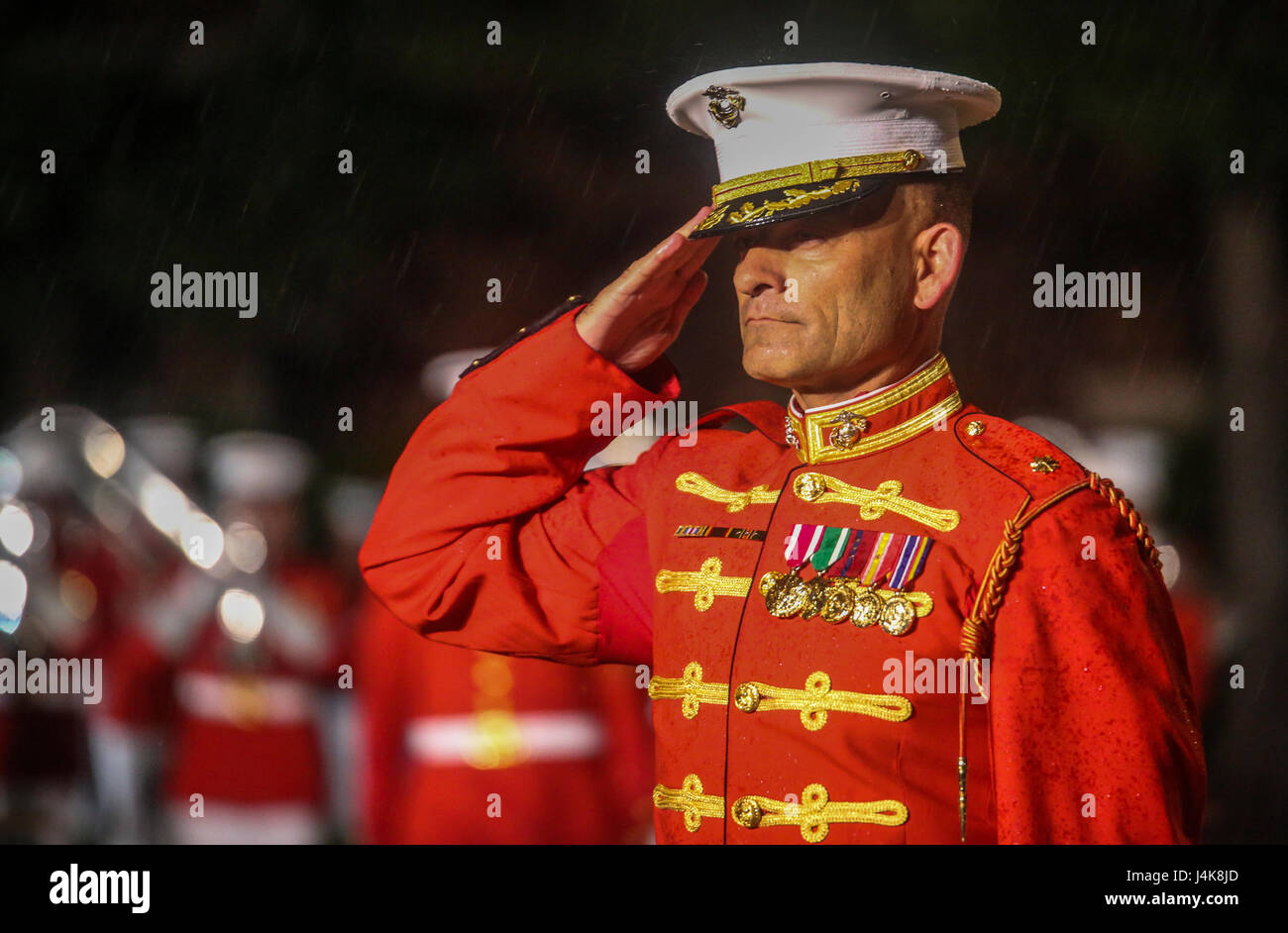 Major Christopher Hall, commanding officer, U.S. Marine Drum & Bugle Corps, salutes the parade commander during a Friday Evening Parade at Marine Barracks Washington D.C., May 5, 2017. The guests of honor for the parade were the Honorable Paul Cook, California’s 8th Congressional District Congressman, the Honorable Jack Bergman, Michigan’s 1st Congressional District Congressman, and the Honorable Salud Carbajal, California’s 24th Congressional District Congressman. The hosting official was Gen. Glenn Walters, assistant commandant of the Marine Corps.(Official Marine Corps photo by Lance Cpl. D Stock Photo