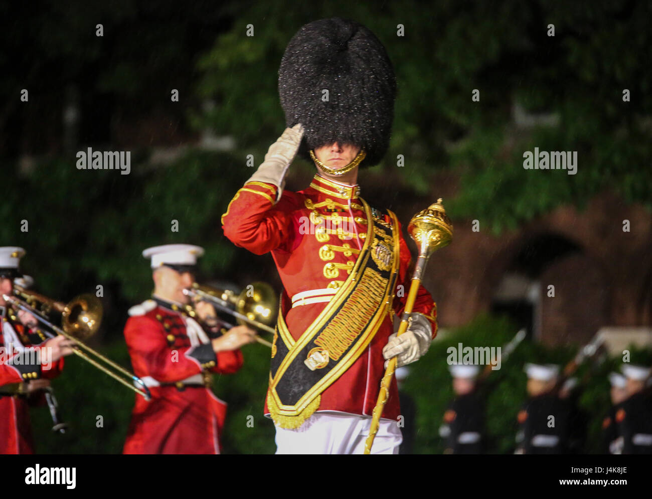 Master Sgt. Duane King, drum major, “The President’s Own”U.S. Marine Corps Band, salutes the hosting official and guests of honor during a Friday Evening Parade at Marine Barracks Washington D.C., May 5, 2017. The guests of honor for the parade were the Honorable Paul Cook, California’s 8th Congressional District Congressman, the Honorable Jack Bergman, Michigan’s 1st Congressional District Congressman, and the Honorable Salud Carbajal, California’s 24th Congressional District Congressman. The hosting official was Gen. Glenn Walters, assistant commandant of the Marine Corps.(Official Marine Co Stock Photo