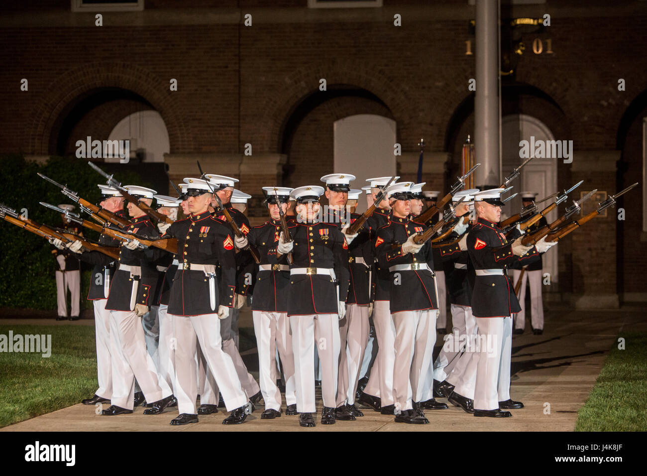 The U.S. Marine Corps Silent Drill Platoon executes the 'bursting bomb' during a Friday Evening Parade at Marine Barracks Washington D.C., May 5, 2017. The guests of honor for the parade were Rep. Paul Cook of California’s 8th Congressional District, Rep. Jack Bergman of Michigan’s 1st Congressional District, and Rep. Salud Carbajal of California’s 24th Congressional District. The hosting official was Gen. Glenn Walters, the assistant commandant of the Marine Corps. (U.S. Marine Corps photo by Cpl. Robert Knapp) Stock Photo