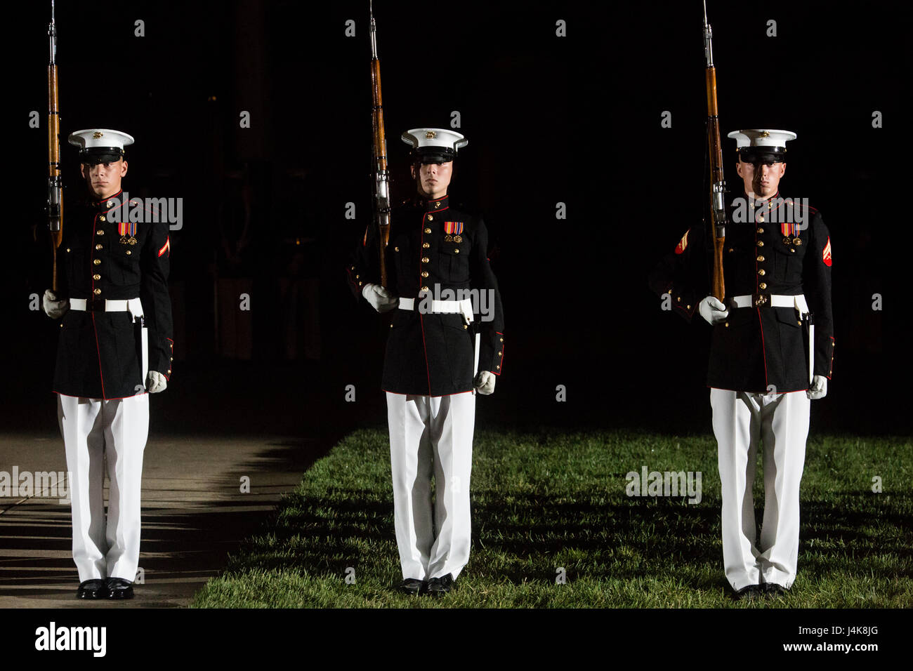 The U.S. Marine Corps Silent Drill Platoon executes their long line sequence during a Friday Evening Parade at Marine Barracks Washington D.C., May 5, 2017. The guests of honor for the parade were the Honorable Paul Cook, California’s 8th Congressional District Congressman, the Honorable Jack Bergman, Michigan’s 1st Congressional District Congressman, and the Honorable Salud Carbajal, California’s 24th Congressional District Congressman. The hosting official was Gen. Glenn Walters, assistant commandant of the Marine Corps. (Official Marine Corps photo by Cpl. Robert Knapp/Released) Stock Photo
