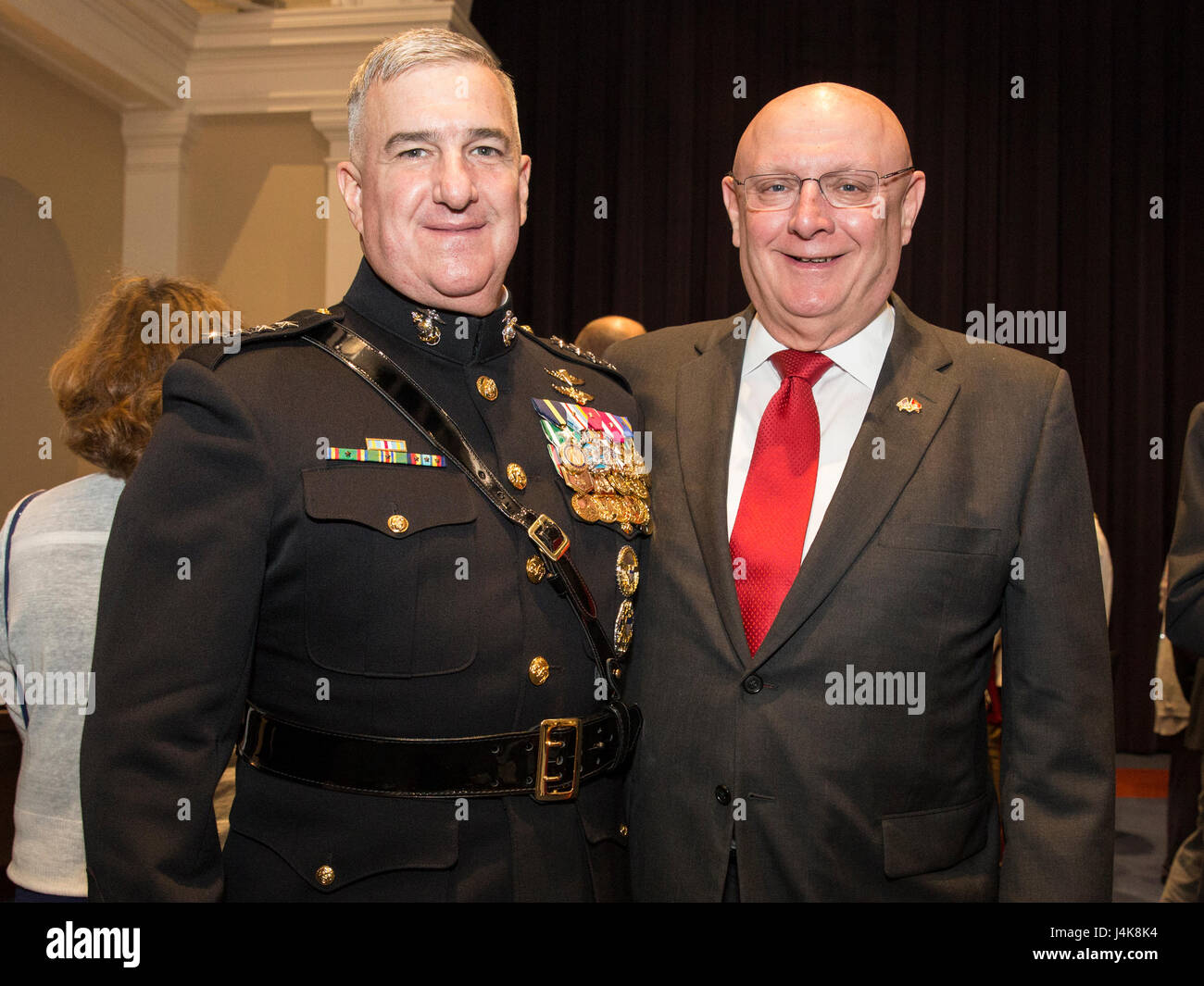 U.S. Marine Corps Gen. Glenn M. Walters, left, 34th assistant commandant of the Marine Corps, poses for a photo with a guest during a reception prior to an evening parade, Marine Barracks Washington, Washington, D.C., May 5, 2017. Evening parades are held as a means of honoring senior officials, distinguished citizens and supporters of the Marine Corps. (U.S. Marine Corps photo by Lance Cpl. Hailey D. Clay) Stock Photo
