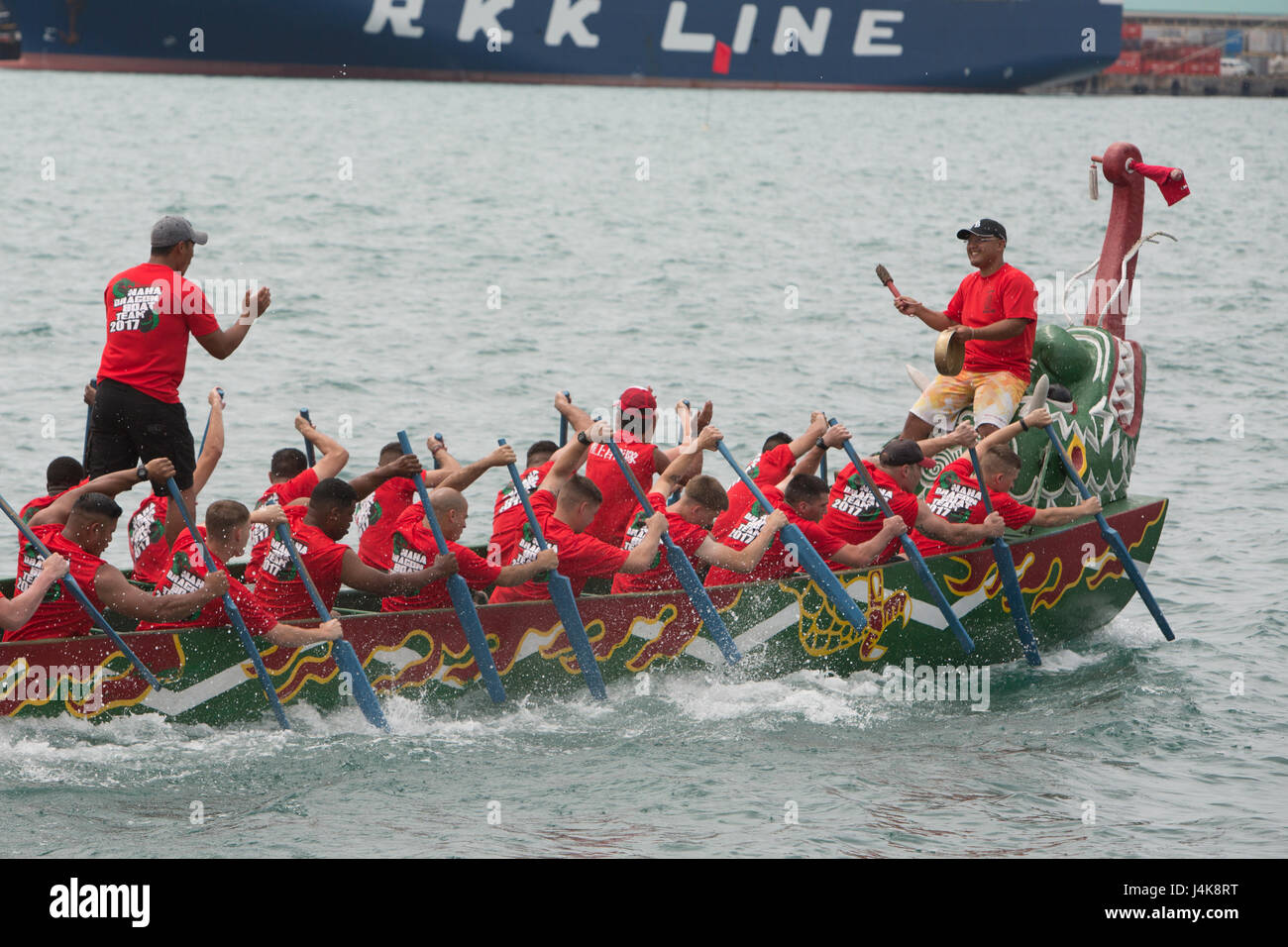 The Single Marine Program’s dragon boat team digs deep with their paddles battling for a win during the 43rd Naha Harii Festival Dragon Boat races May 5 in Naha City, Okinawa, Japan. Marines came together from Camps Courtney, Hansen and Marine Corps Air Station Futenma to build this team. The Marines finished their race with a time of 5 minutes, 58.6 seconds. Stock Photo