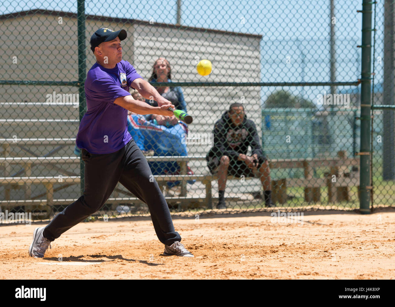 MAYPORT, Fla. (May 5, 2017) – Logistics Specialist 2nd Class Kevin Ortega swings at a pitch during a softball game between the amphibious assault ship USS Iwo Jima’s (LHD 7) Wardroom and Second Class Petty Officer Association (SCPOA).  The game was held as part of a tournament between the ship’s Wardroom, First Class Petty Officer Association, Chief Petty Officer Association & SCPOA to build camaraderie and morale among the ship’s crew. (U.S. Navy photo by Mass Communication Specialist 2nd Class Hunter S. Harwell/Released) Stock Photo