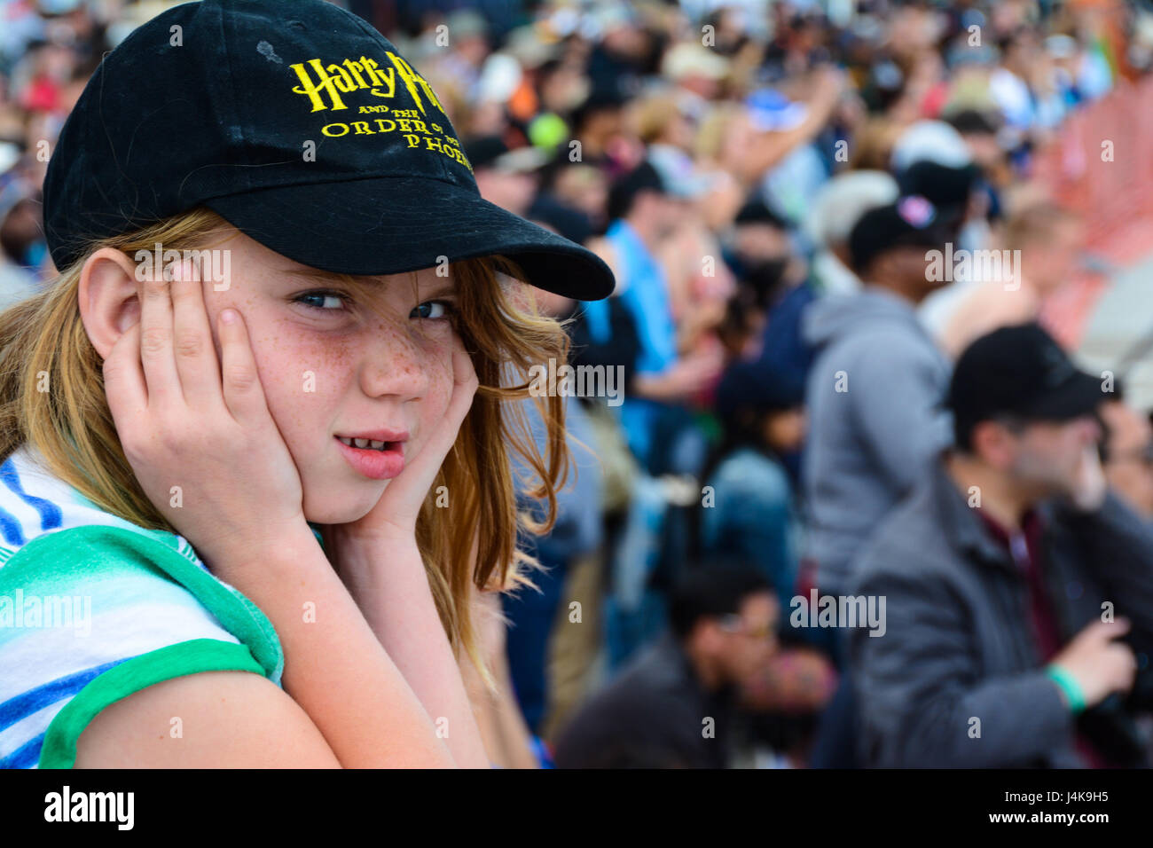 A child covers her ears as the U.S. Air Force Thunderbirds start their engines at Wings Over