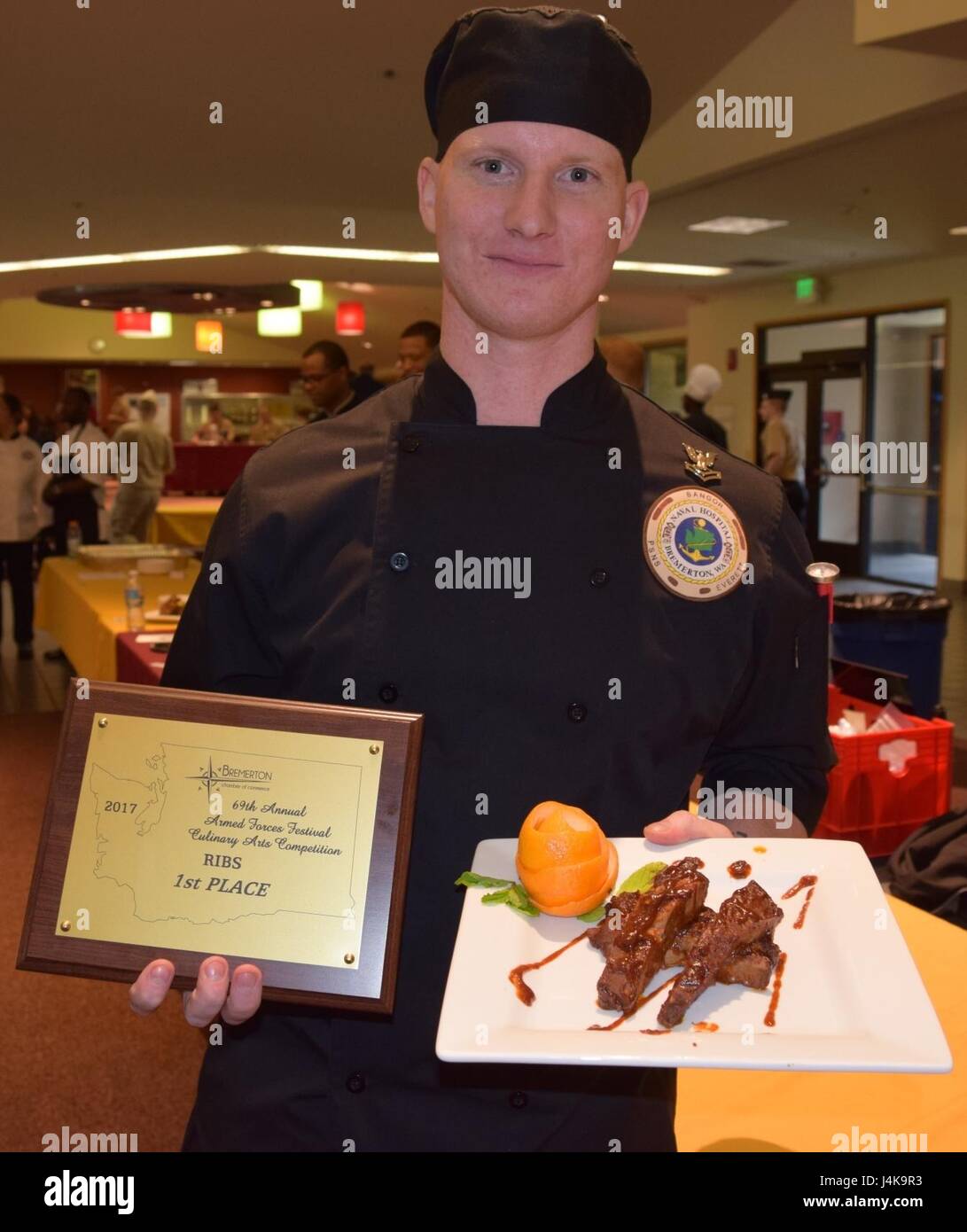 A handful of excellence...the 2017 69th Annual Armed Force Festival’s Culinary Arts Competition winner in the highly-contested 'Ribs' category was awarded to Culinary Specialist 2nd Class Christopher Wojcik of Naval Hospital Bremerton (Official Navy photo by Douglas H Stutz, Naval Hospital Bremerton Public Affairs). Stock Photo