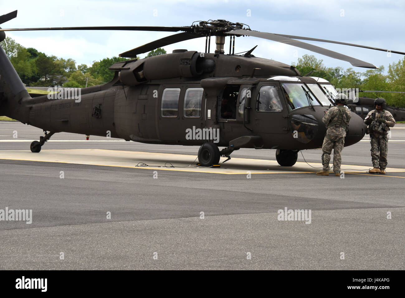 ARMY AVIATION SUPPORT FACILITY, Del. -  Members of the 238th Army Aviation Regiment, Delaware National Guard, prepare for departure to the Joint Base McGuire-Dix Lakehurst, N.J. on May 7, 2017. A four-ship formation of Blackhawk helicopters from the 238th provided airlift of approximately 40 security forces personnel from the DNG Army Aviation Support Facility to Fort Dix. Delaware Air National Guard security defenders will spend eleven days conducting annual training in areas such as: urban combat training, combat life saver training, self-aid buddy care, and weapons qualifications training a Stock Photo
