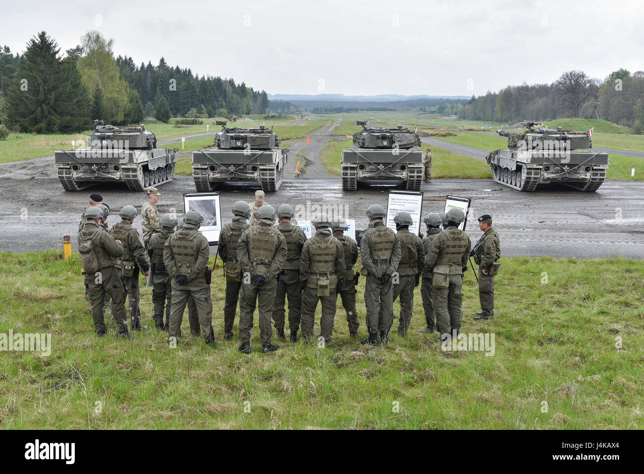 Austrian soldiers with the Bundesheer platoon, get briefed before ...