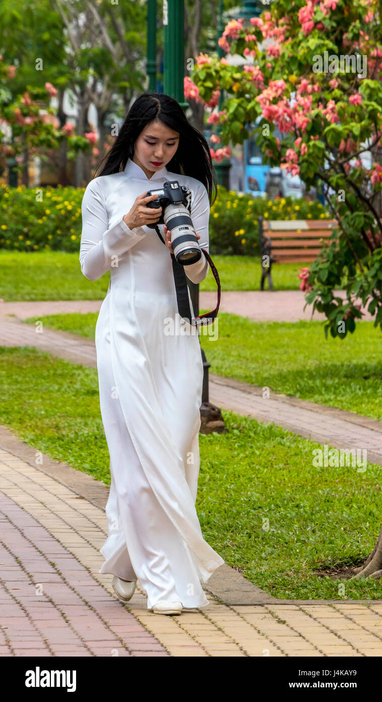 Ladies wearing traditional Vietnamese garment the Au dai in Ho Chi Minh