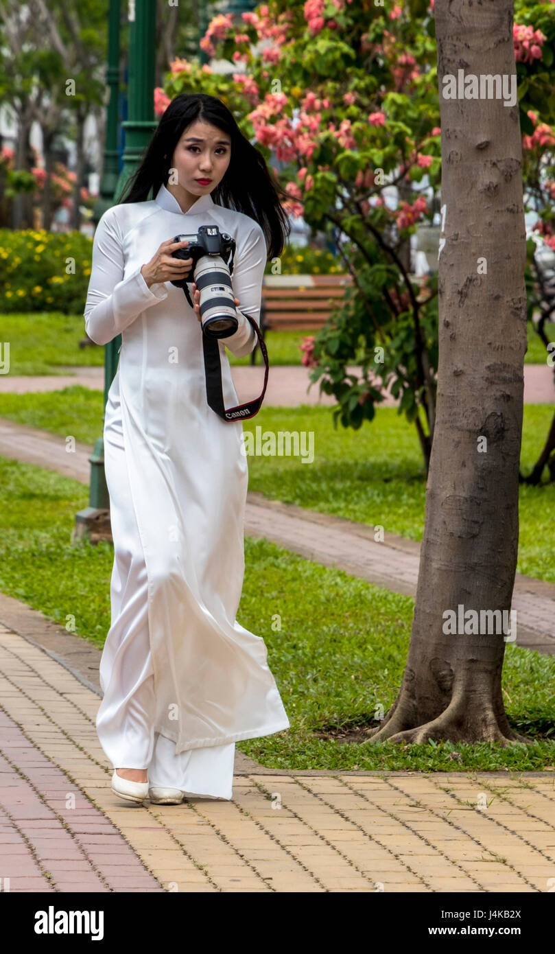 Ladies wearing traditional Vietnamese garment the Au dai in Ho Chi Minh