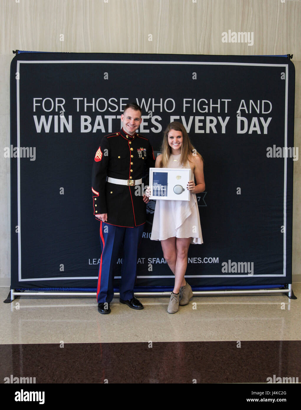 U.S. Marine Sgt. Roderick Evans presents the All-American Natasha ...
