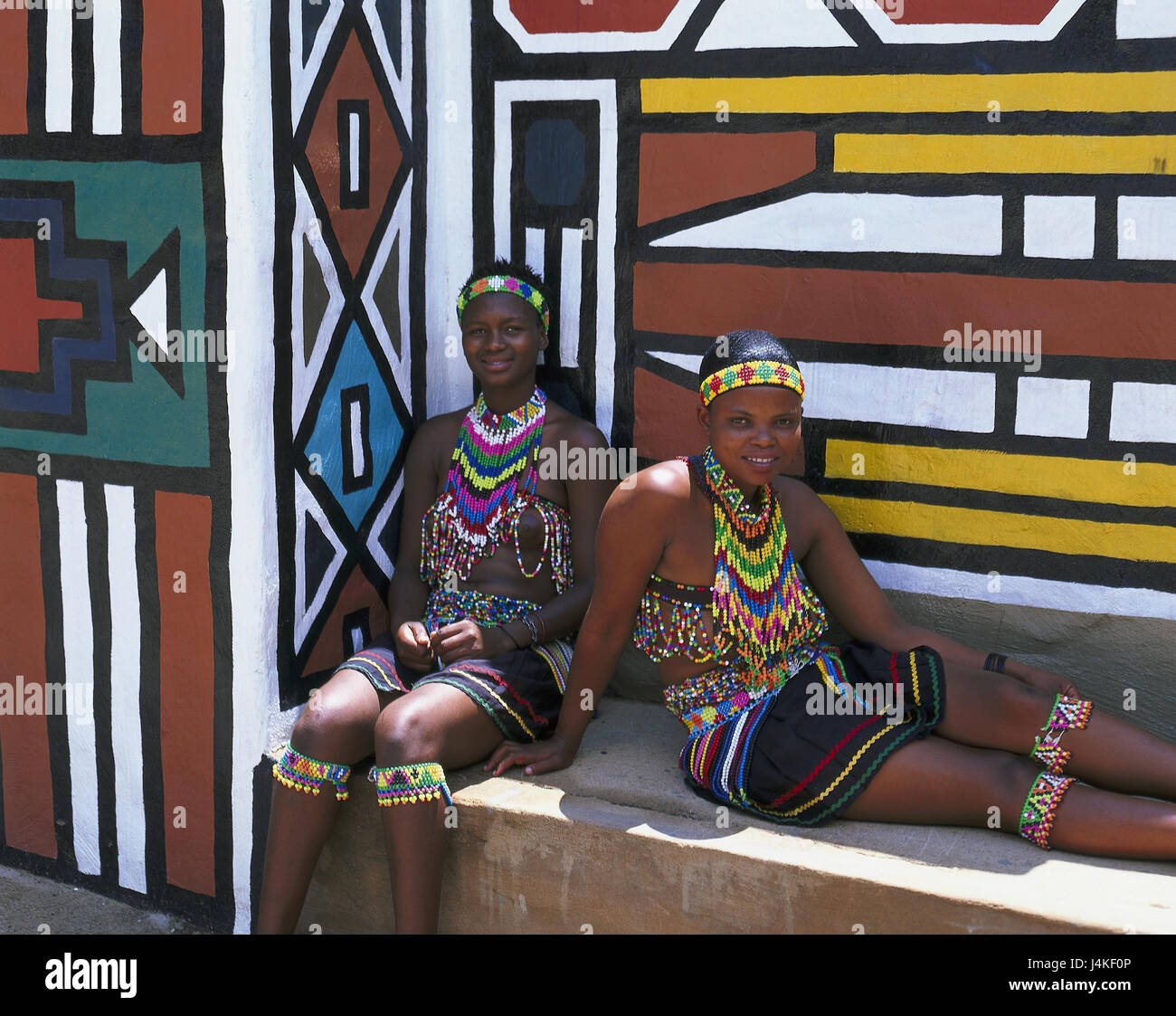 South Africa, Lesedi, defensive wall, paints, Zulu's women, folklore clothes no model release Africa, close Johannesburg, tribe, Zulu tribe, locals, non-whites, Africans, clothes, jewellery, tradition, culture, tourist attraction Stock Photo