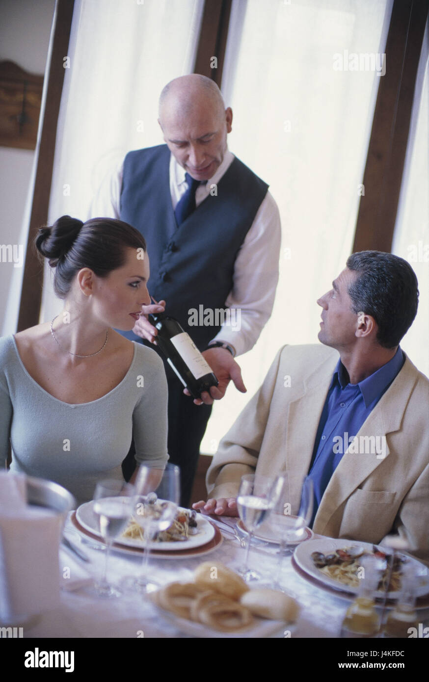 Couple, restaurant, spaghetti, waiters, wine, serve spaghetti