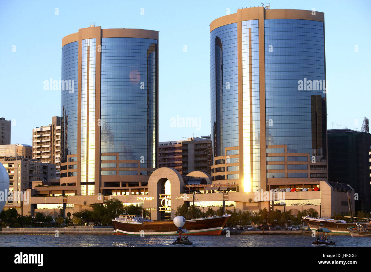 United Arab Emirates, Dubai, town view, Deira, Twin of Tower, harbour, sundown VAE, Arabian peninsula, the Middle East, capital, Dubai Creek, Al-Khor harbour, structures, buildings, two, builds in 1998, architect Leo A. Daly, glass fronts, reflector facades, architecture, place of interest, outside Stock Photo