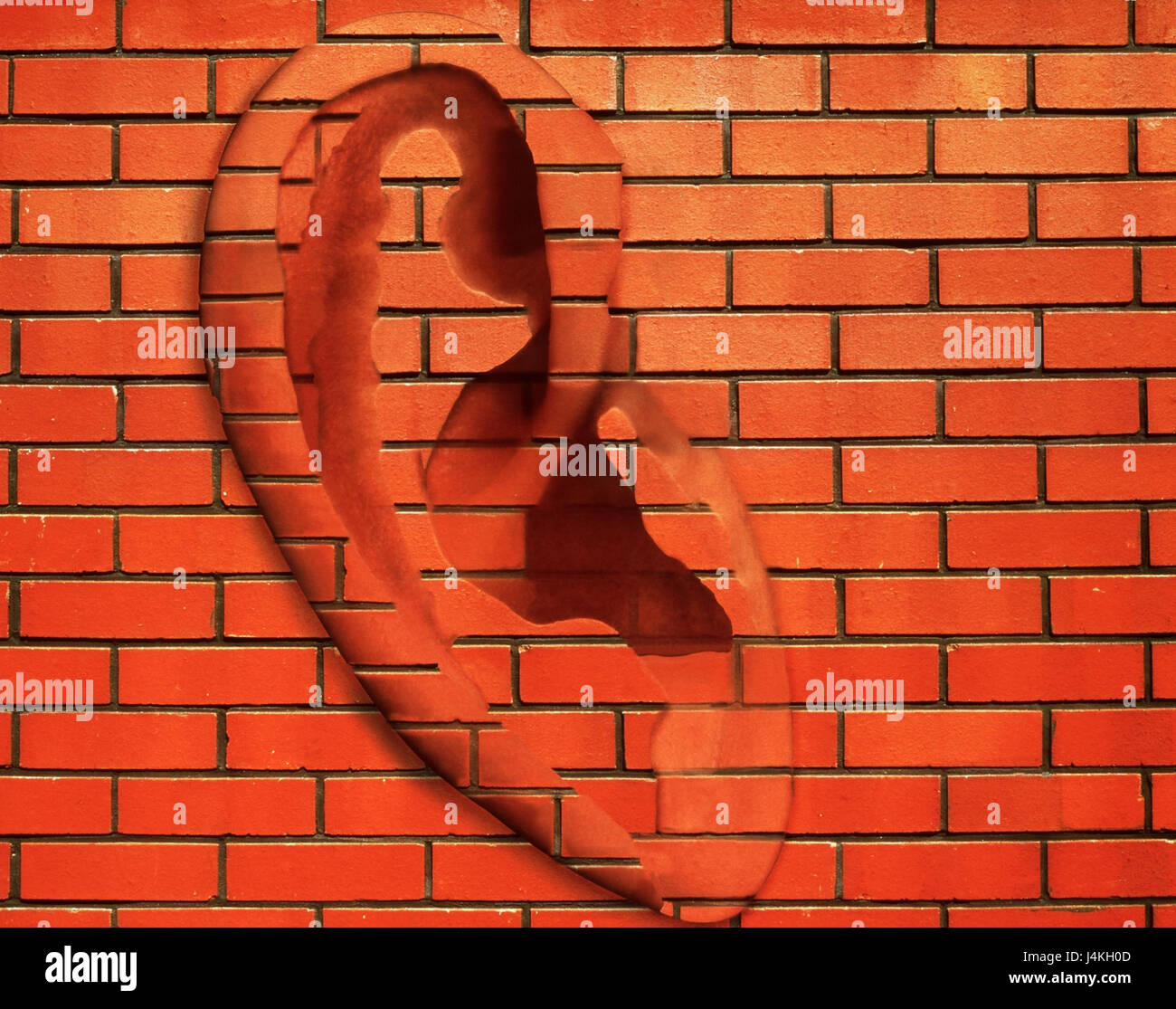 Brick walling, ear, phrase, 'the walls have ears', icon, light bondage defensive wall, red bricks, clay bricks, wall, light dependent, hear, spy, spying, listen, listen to Stock Photo