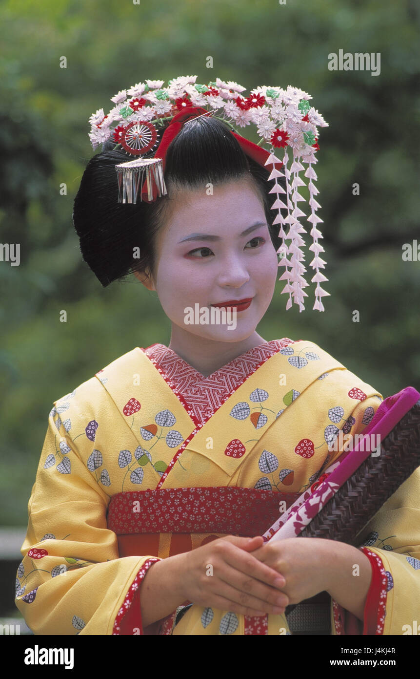 Japan, Kyoto, Maiko girls, smile, portrait no model release! Asia, Eastern Asia, island state, Nippon, Nihon Koku, Honshu, Asian, woman, professional training, education, geisha, clothes, kimono, traditionally, tradition, ethnically, folklore, make-up, greasepaint, made up, occupation, career plans, women's portrait, hair ornament, view at the side Stock Photo