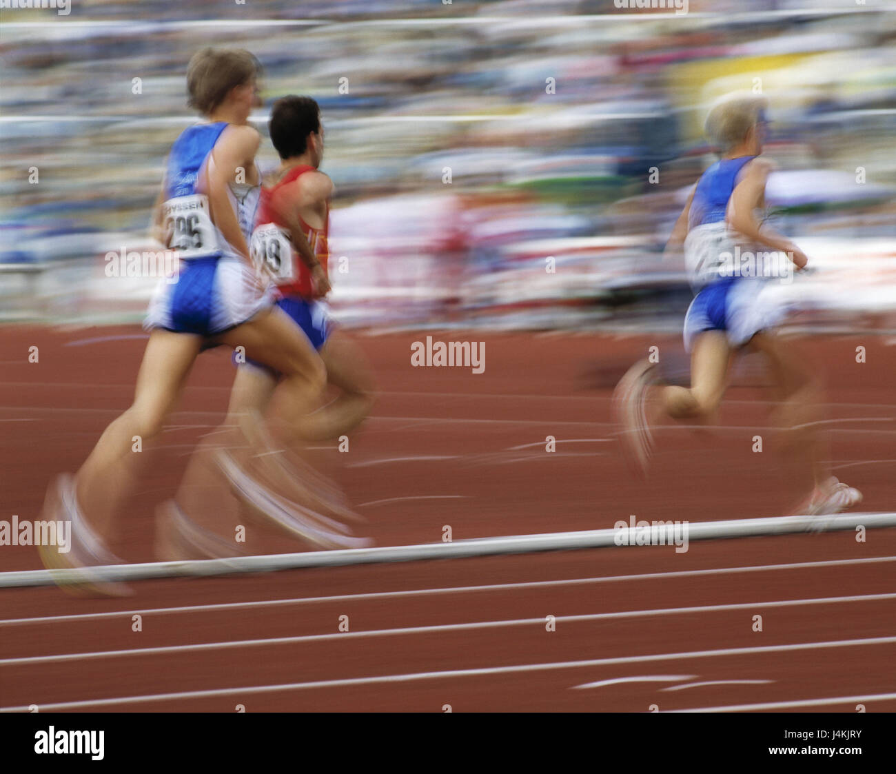 Sports stadium, athletics event, runner, at the side, motion blur