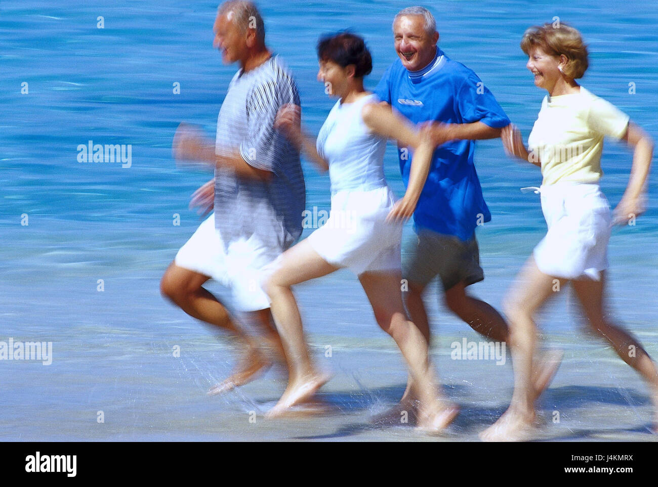 Couples, middle old person, beach run, blur summer, vacation, leisure time, lifestyle, four, friends, together, fun, happily, tuning, positively, sport, sportily, beach, sea, run, jog, jogging, fit fitness, agile, motion, activity, leisurewear, motion blur Stock Photo