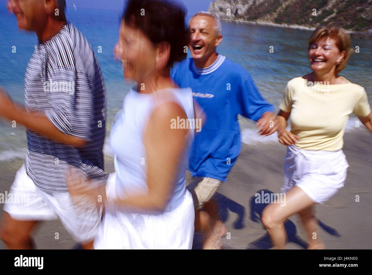 Couples, middle old person, beach run, half portrait, blur outside, summer, vacation, leisure time, lifestyle, four, friends, together, fun, happily, tuning, positively, sport, sportily, beach, sea, run, jog, jogging, fit fitness, agile, motion, activity, leisurewear Stock Photo