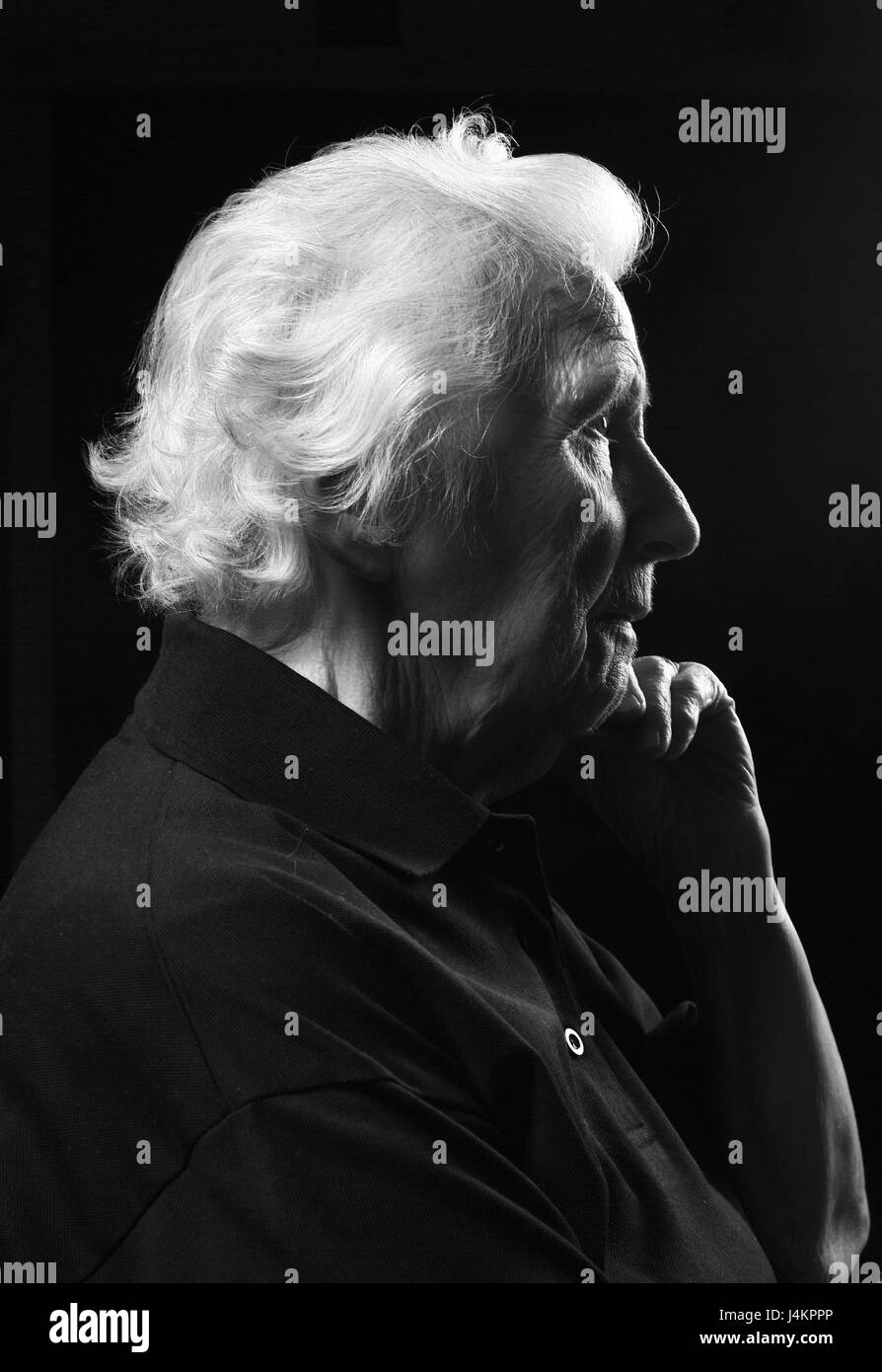 Senior, gesture, thoughtfully, tread, s/w senior citizens, 80-90 years, grey-haired, pensioner, woman, old, old woman, old men, old ages, old age, sadly, lonely, loneliness, thought, past, old person, studio, darkness Stock Photo