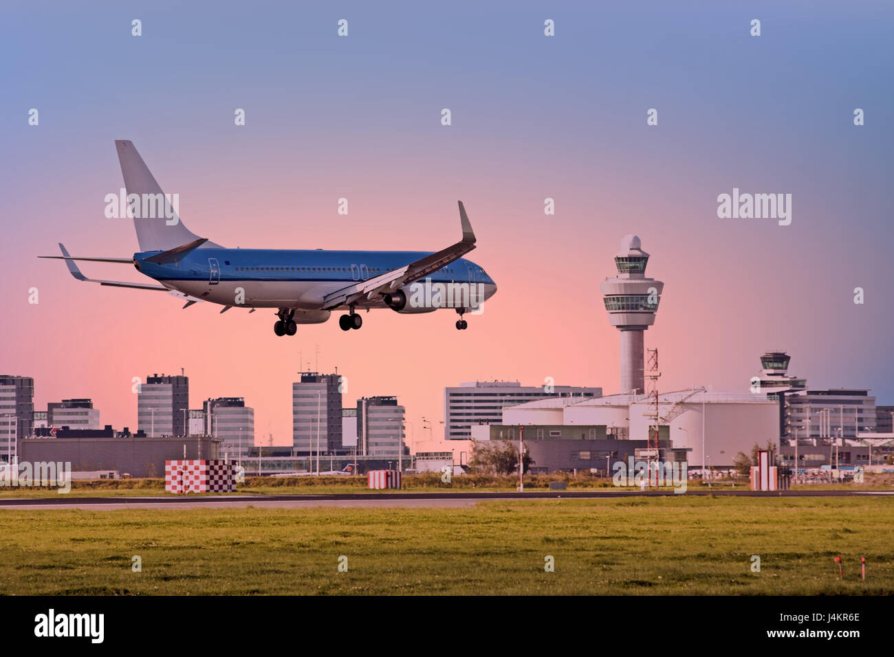 Airplane landing on Schiphol airport in Amsterdam in the Netherlands Stock Photo