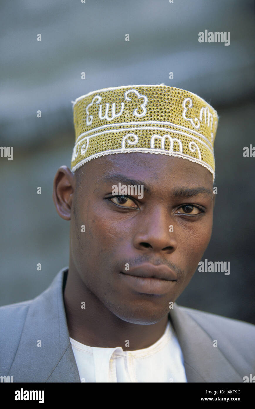 The Comoro Archipelago, island Anjouan, Mutsamudu, man, young, cap, portrait no model release! Africa, Indian ocean, island state, Nzwani, man's portrait, young, non-white, swarthy, swarthy, local, headgear, traditionally, tradition, faith, religion, religiously, Moslem, Islamic, Islam, view camera Stock Photo