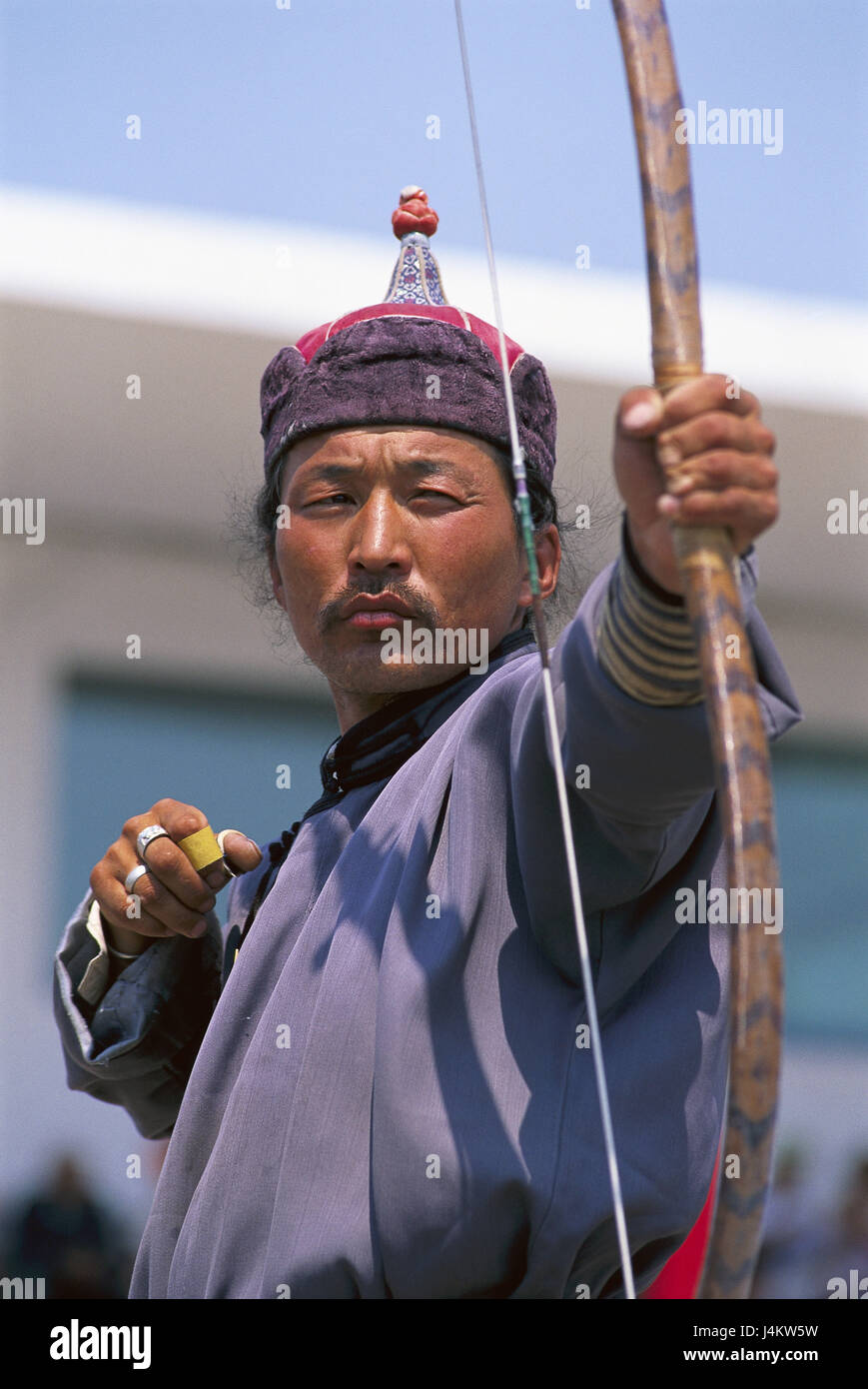 Mongolia, Ulan Bator, Naadam feast, archer, half portrait no model release Central Asia, local, Mongol, man, arrow and bow, archery, concentration, event, tradition, traditions, feast, Staatsnaadam, event, summer, conception, sport, strain, accuracy, destination security, meeting, shoot, outside Stock Photo
