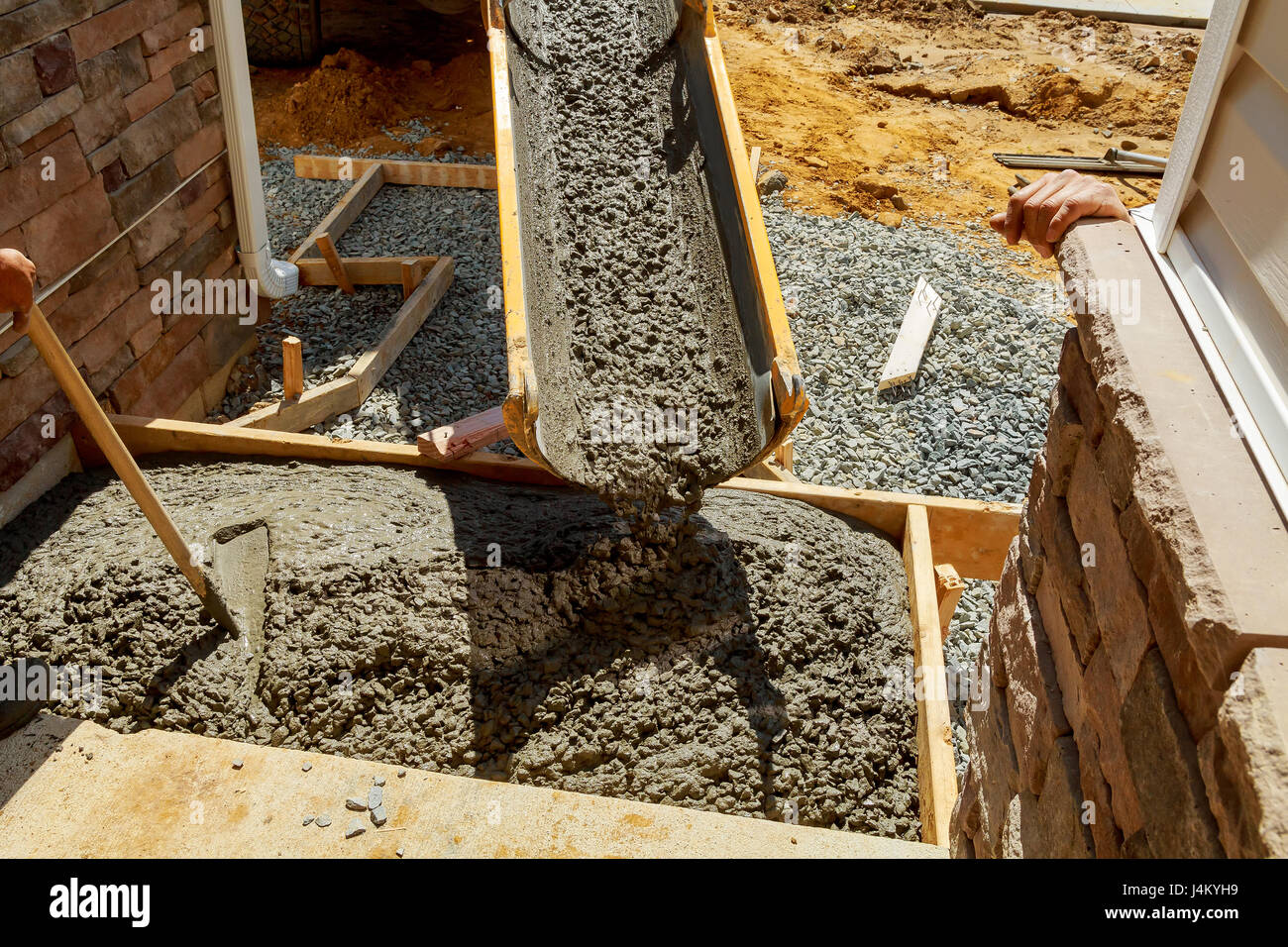 Concrete pouring during commercial concreting floors of building Stock Photo