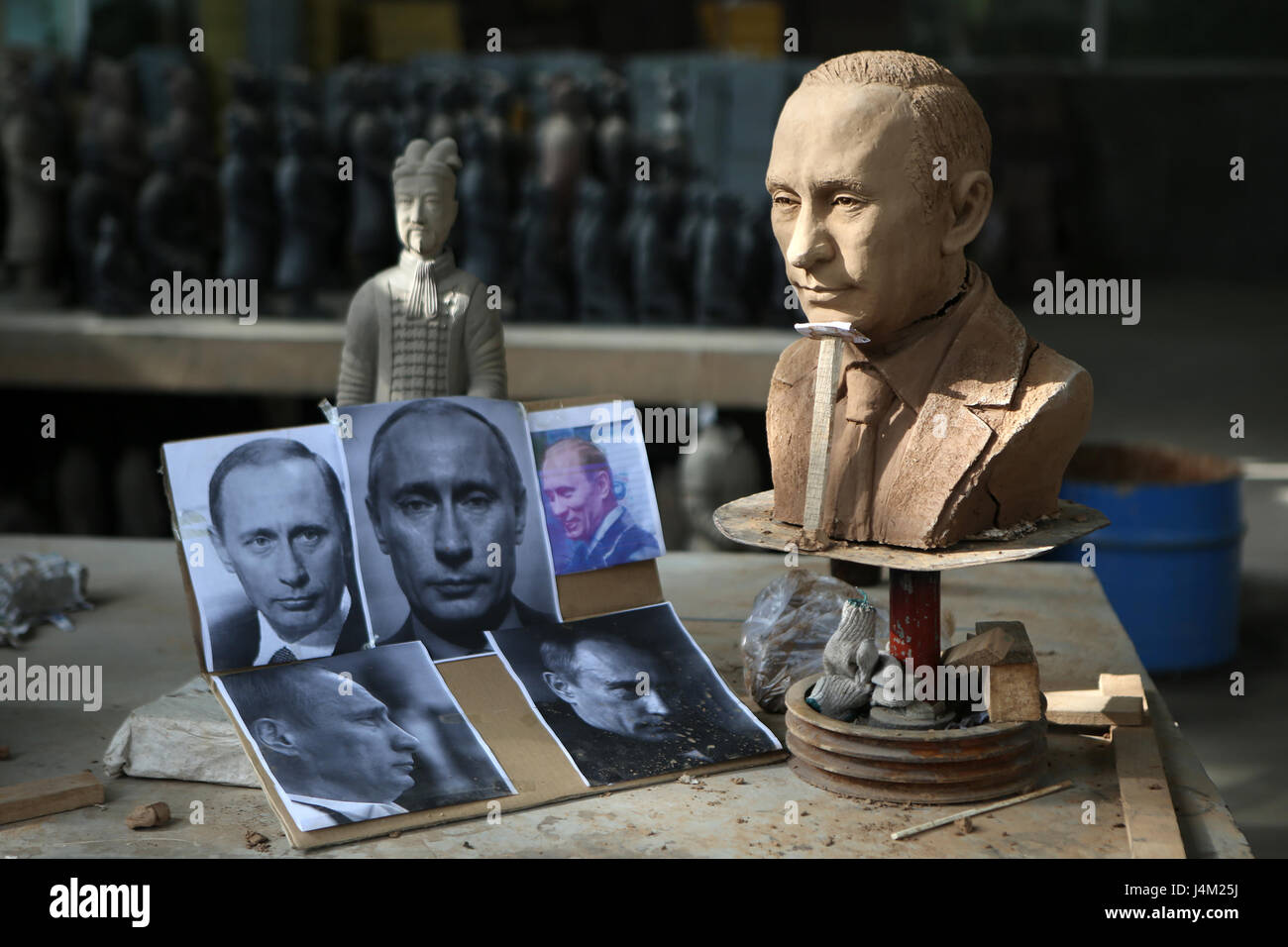 Modern sculpture and photos of Vladimir Putin, near Xian, China Stock Photo