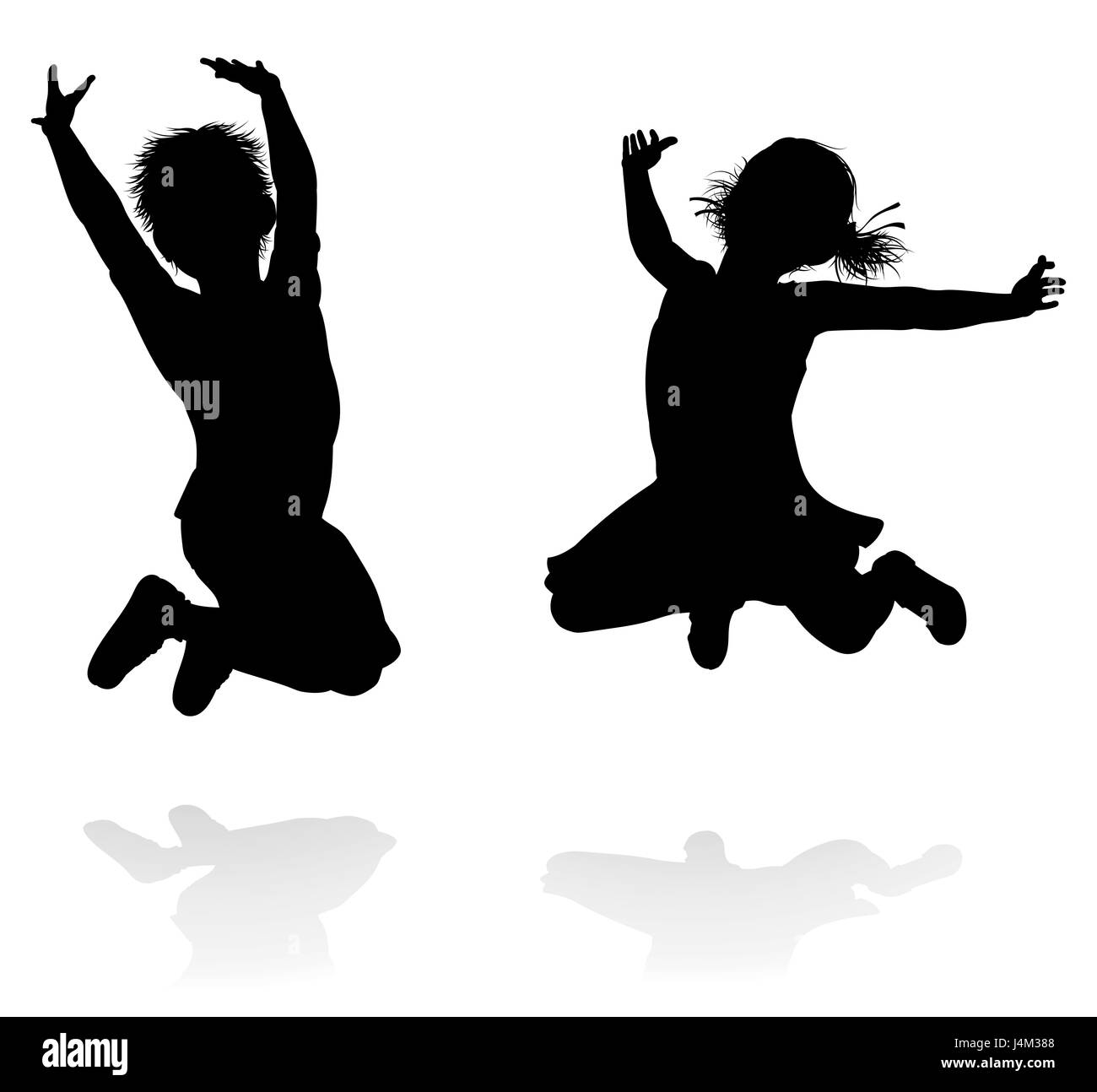 Happy boy and girl silhouette kids or children jumping Stock Photo