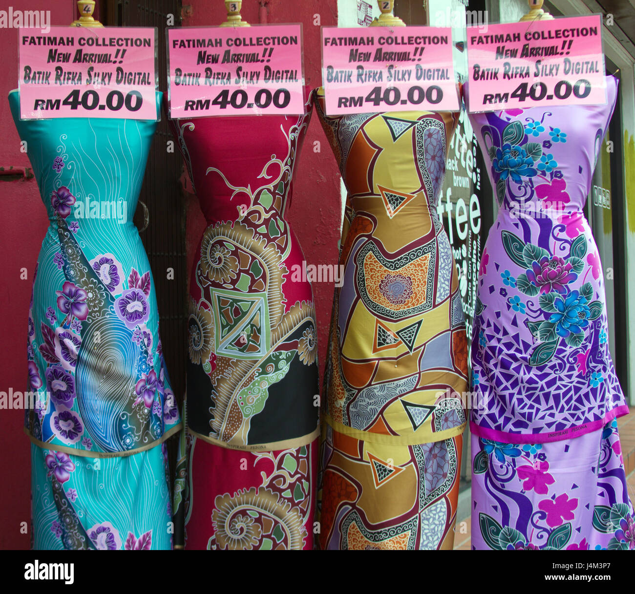 'Digital batik' gowns displayed on mannequins in a shop in Kampung Cina (Chinatown),Kuala Terengganu, Terengganu state, Malaysia Stock Photo