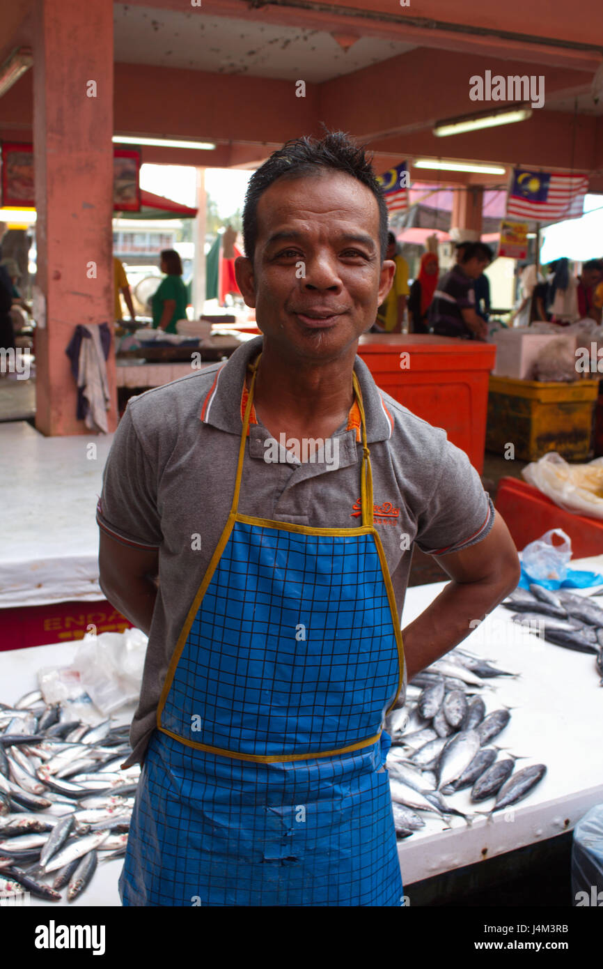 A fishmonger called Hamdun at the market hall of Dungun, Terengganu ...