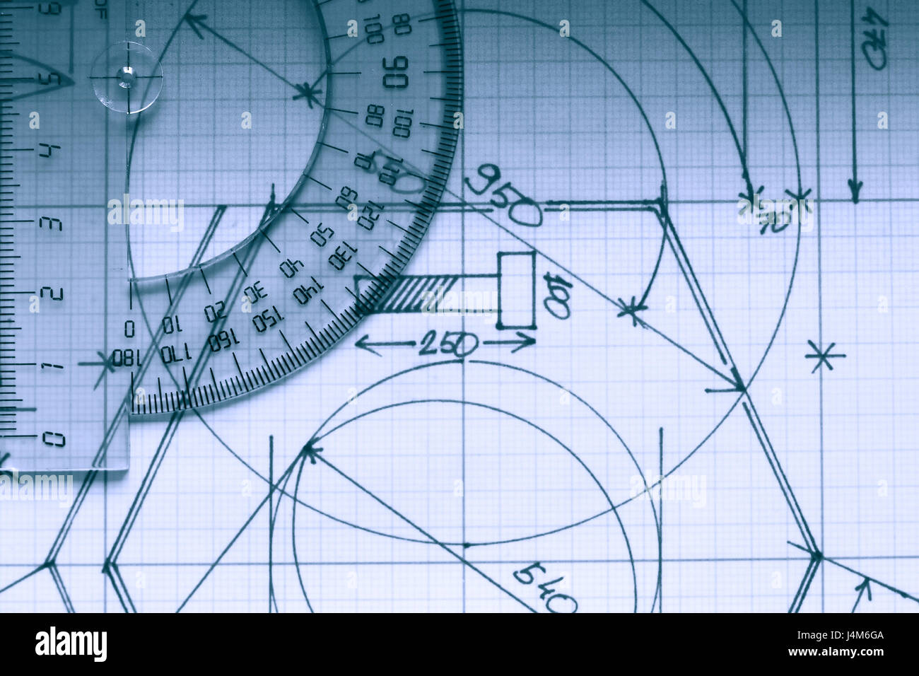 Closeup of protractor on graph paper with draft Stock Photo Alamy