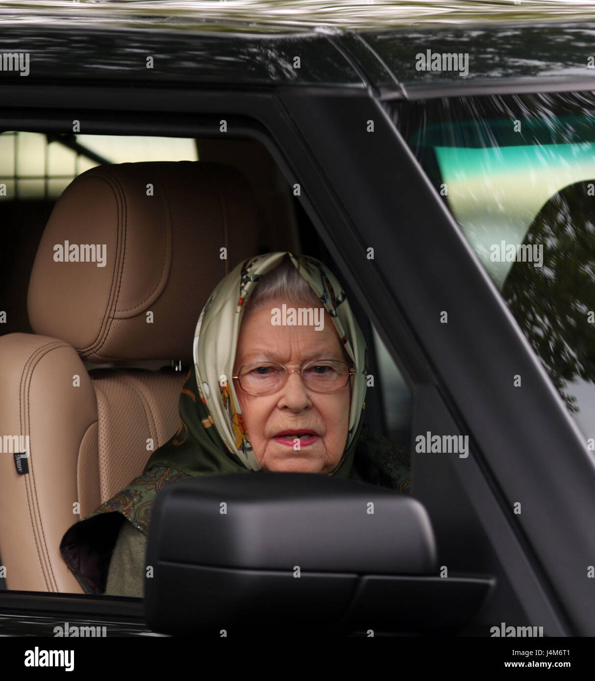 Queen Elizabeth II watches the Land Rover Driving Grand Prix at the Royal Windsor Horse Show
