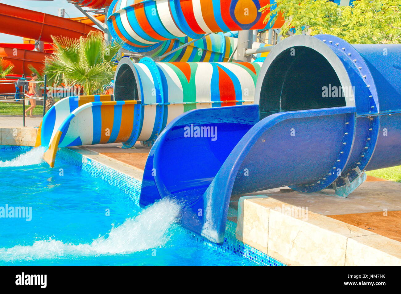 blue and colorful slide. The attraction of the water park Stock Photo