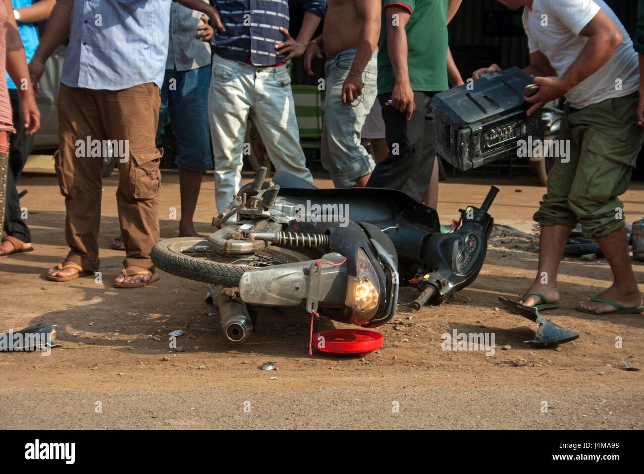 People are gathered at the scene of a motorcycle accident in Chork village, Tboung Khmum province, Cambodia Stock Photo