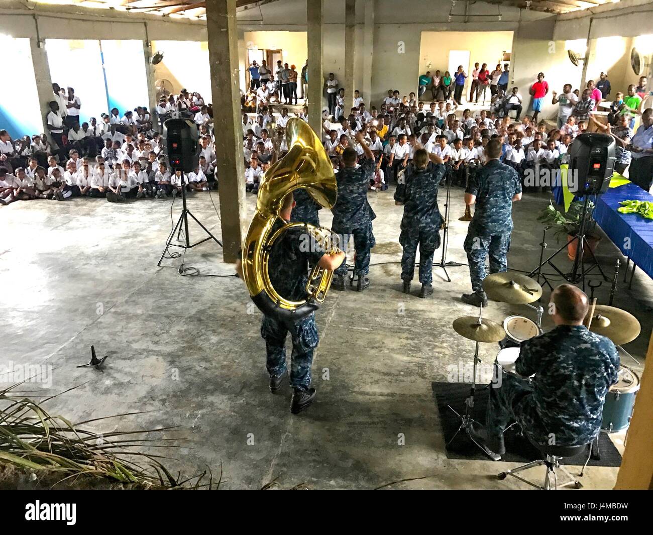 170222-N-YL073-001   SANTA FE, Honduras (Feb. 22, 2017) Members of the U.S. Fleet Forces (USFF) Band perform for host nation school children in support of Continuing Promise 2017 (CP-17) in Sante Fe, Honduras. CP-17 is a U.S. Southern Command-sponsored and U.S. Naval Forces Southern Command/U.S. 4th Fleet-conducted deployment to conduct civil-military operations including humanitarian assistance, training engagements, and medical, dental, and veterinary support to Central and South America. (U.S. Navy photo by Mass Communication Specialist 2nd Class Shamira Purifoy) Stock Photo