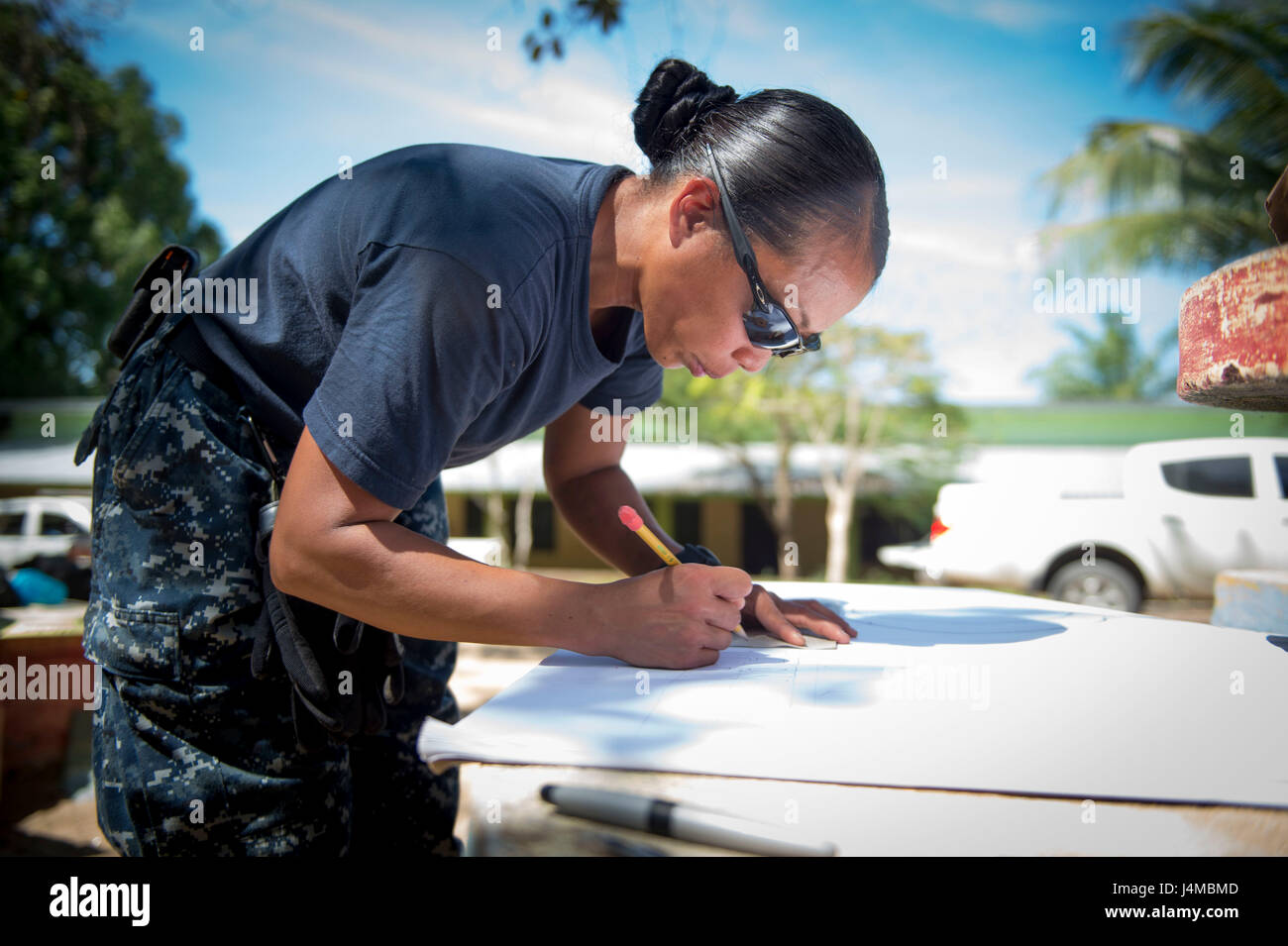 170220-N-YL073-273 TRUJILLO, Honduras (Feb. 20, 2017) – Hospital Corpsman 2nd Class Kristine Perales, a native of Cebu, the Philippines, assigned to the Naval Branch Health Clinic Mayport, Fla., makes a sign to assist patients at the Continuing Promise 2017 (CP-17) medical site in support of CP-17's visit to Trujillo, Honduras. CP-17 is a U.S. Southern Command-sponsored and U.S. Naval Forces Southern Command/U.S. 4th Fleet-conducted deployment to conduct civil-military operations including humanitarian assistance, training engagements, and medical, dental, and veterinary support in an effort t Stock Photo