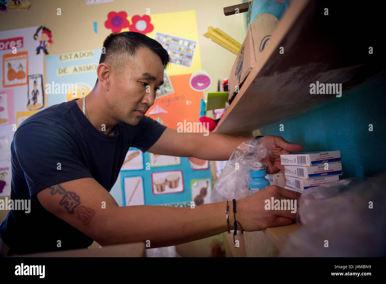 170220-N-YL073-088 TRUJILLO, Honduras (Feb. 20, 2017) – Lt. Donny Le, a native of Boston attached to Naval Hospital Pensacola, Fla., organizes prescription medication at the Continuing Promise 2017 (CP-17) medical site in support of CP-17's visit to Trujillo, Honduras. CP-17 is a U.S. Southern Command-sponsored and U.S. Naval Forces Southern Command/U.S. 4th Fleet-conducted deployment to conduct civil-military operations including humanitarian assistance, training engagements, and medical, dental, and veterinary support in an effort to show U.S. support and commitment to Central and South Amer Stock Photo