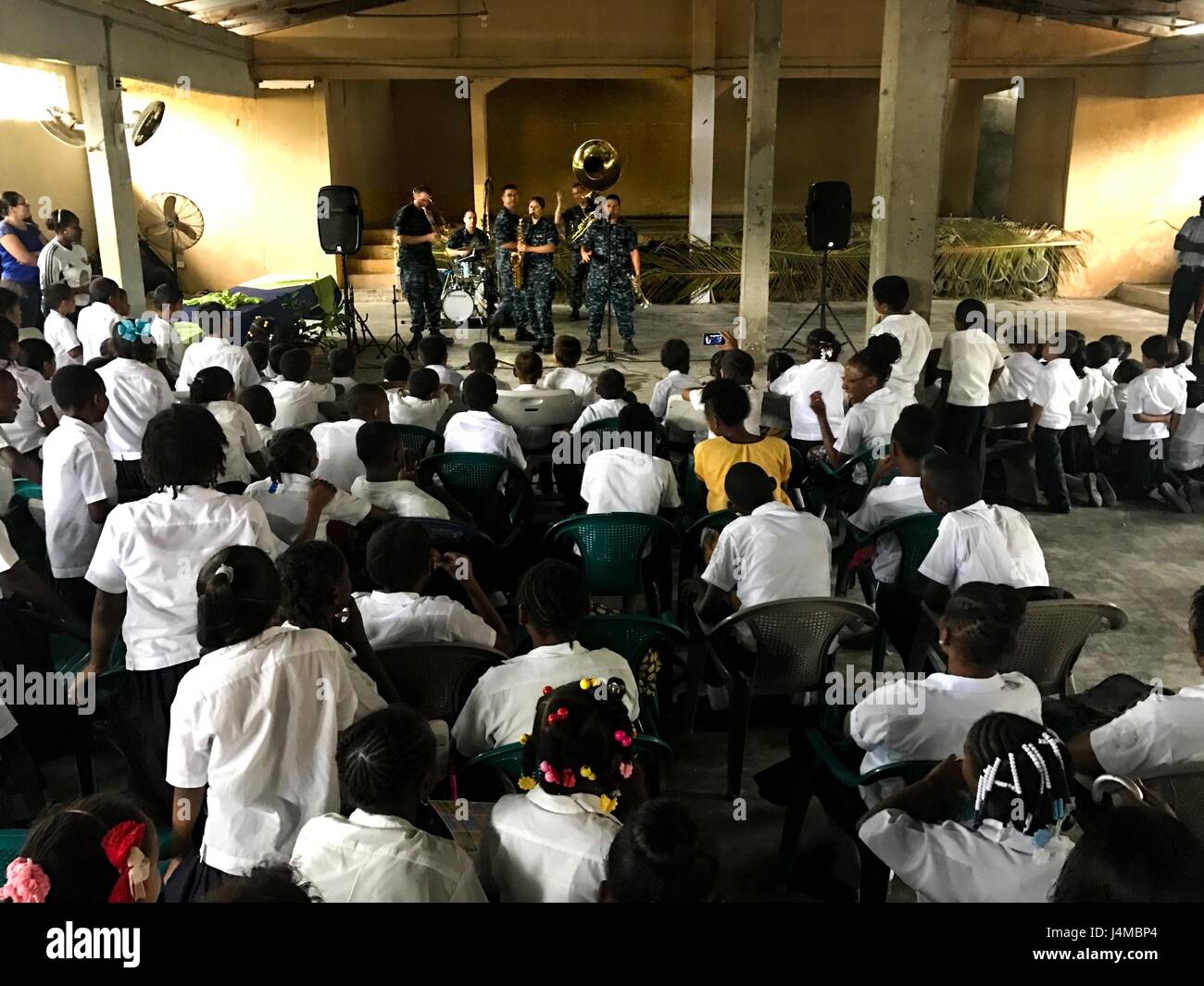 170222-N-YL073-005 SANTA FE, Honduras (Feb. 22, 2017) – Members of the U.S. Fleet Forces (USFF) Band, Norfolk, Va., perform for host nation school children in support of Continuing Promise 2017’s (CP-17) visit to Trujillo, Honduras. CP-17 is a U.S. Southern Command-sponsored and U.S. Naval Forces Southern Command/U.S. 4th Fleet-conducted deployment to conduct civil-military operations including humanitarian assistance, training engagements, and medical, dental, and veterinary support in an effort to show U.S. support and commitment to Central and South America. (U.S. Navy photo by Mass Communi Stock Photo