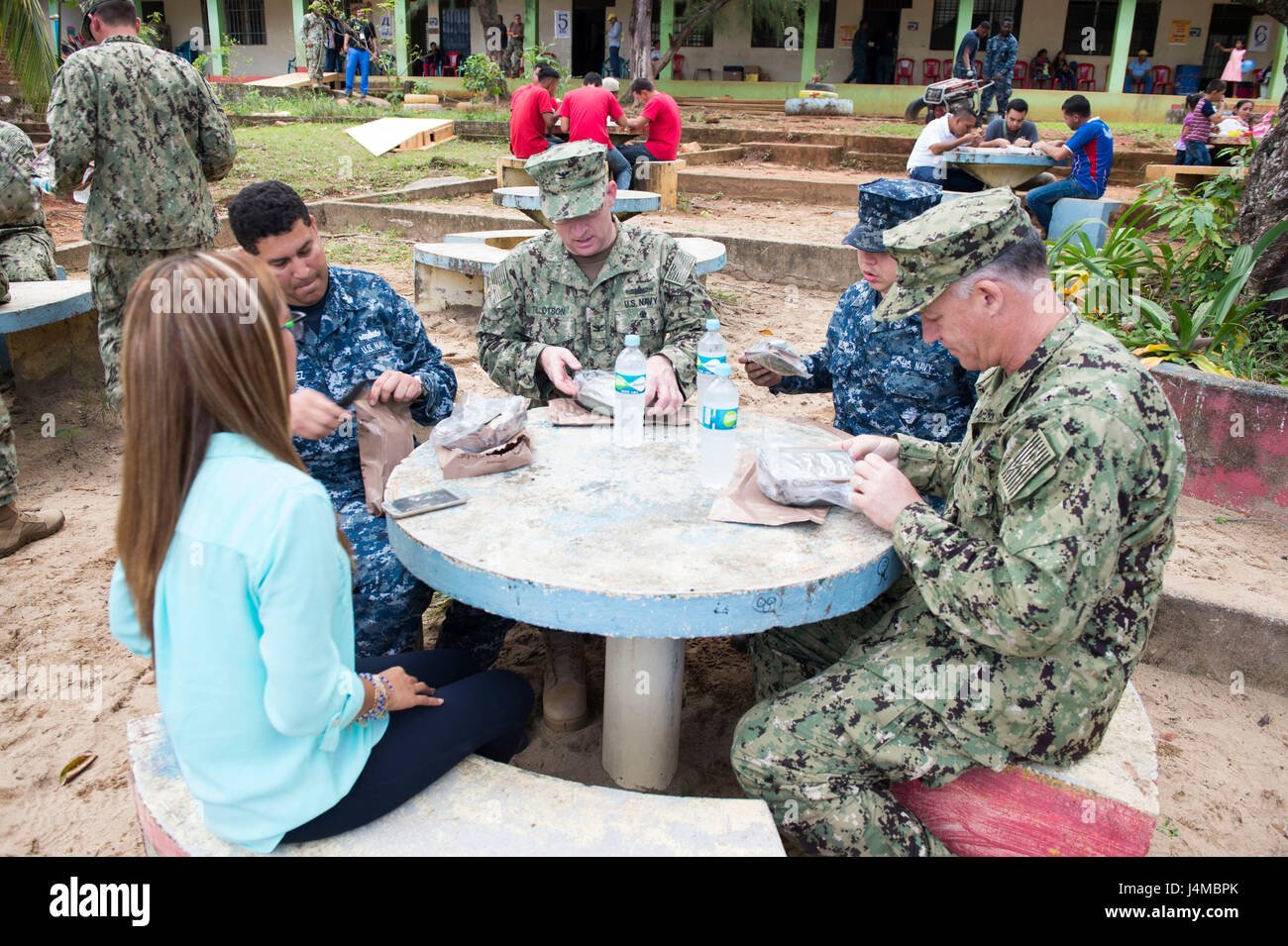170223-N-YL073-483 TRUJILLO, Honduras (Feb. 23, 2017) – Rear Adm. Sean S. Buck, Commander U.S. Naval Forces Southern Command/U.S. 4th Fleet (USNAVSO/FOURTHFLT), eats lunch with Sailors and the acting governor of Colon, Honduras during a tour of the Continuing Promise 2017 (CP-17) medical site in support of the mission's visit to Trujillo, Honduras. CP-17 is a U.S. Southern Command-sponsored and U.S. Naval Forces Southern Command/U.S. 4th Fleet-conducted deployment to conduct civil-military operations including humanitarian assistance, training engagements, and medical, dental, and veterinary s Stock Photo