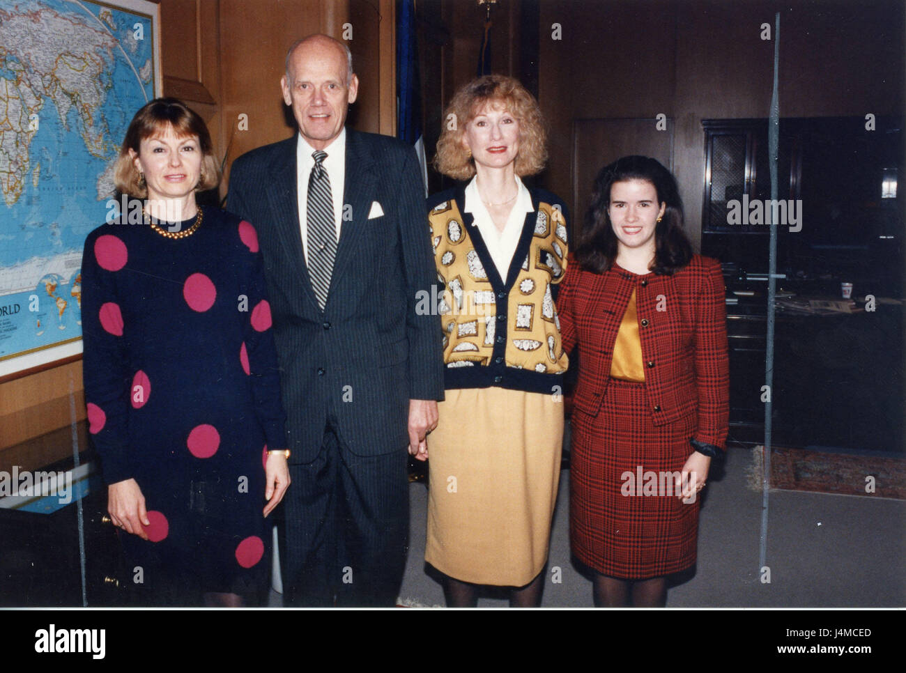 A man and woman pose together for a photograph, standing side by side ...