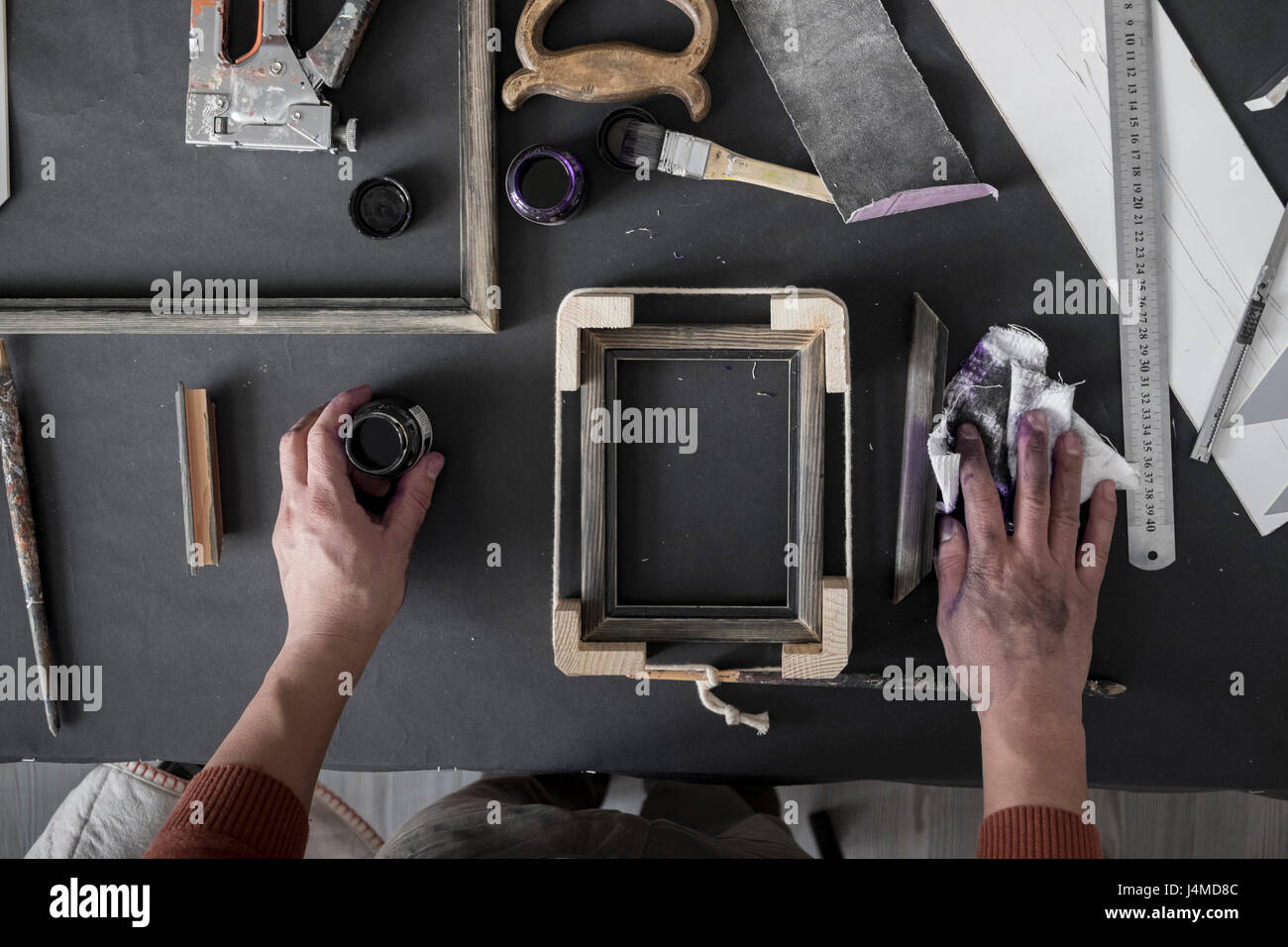 Female hands using wooden tailor ruler to measure cotton fabric. Textile  sale and sewing concept Stock Photo - Alamy