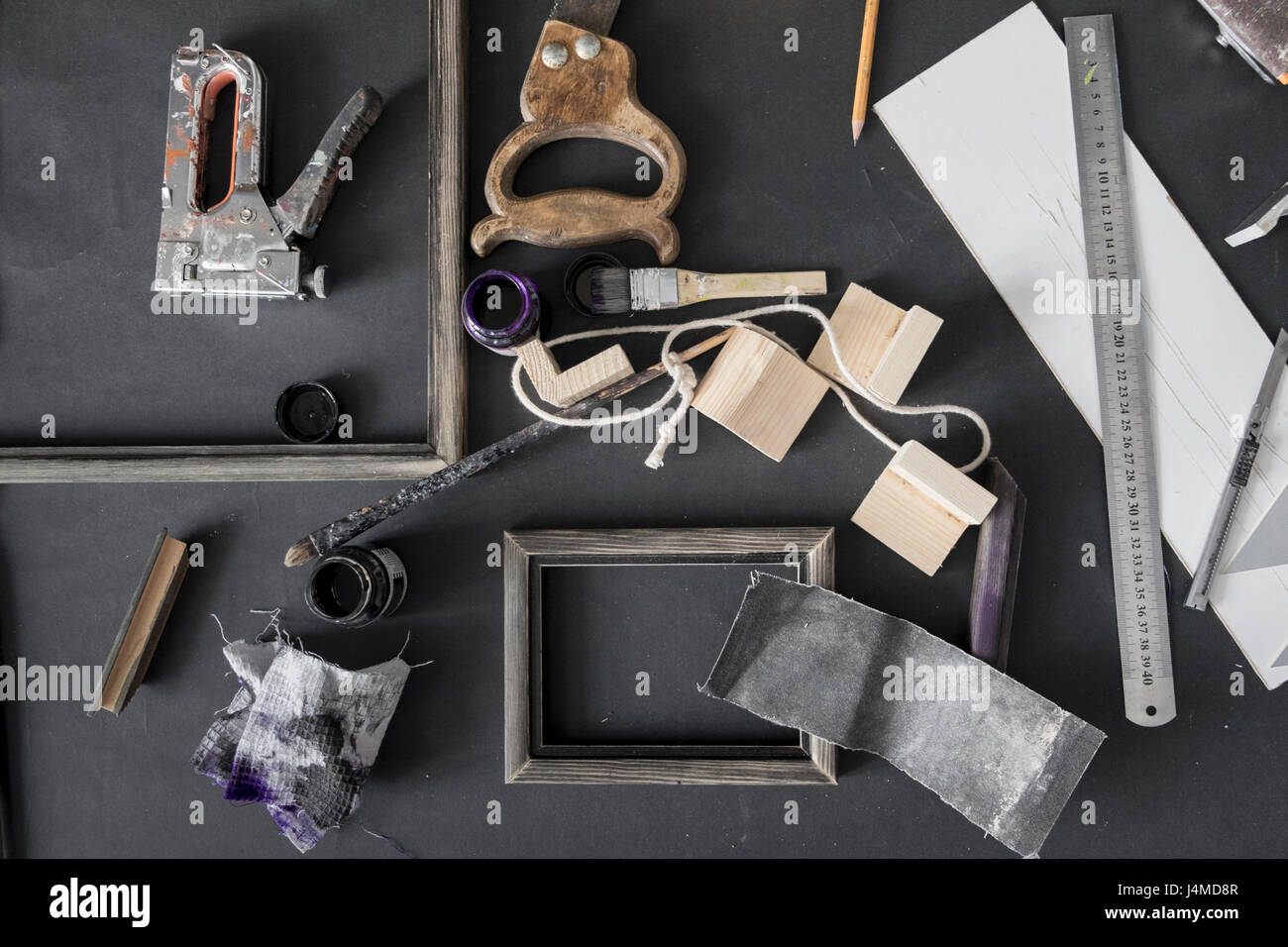 Picture frame and tools on table Stock Photo
