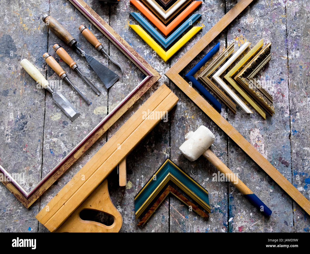 Picture frame tools on splattered table Stock Photo